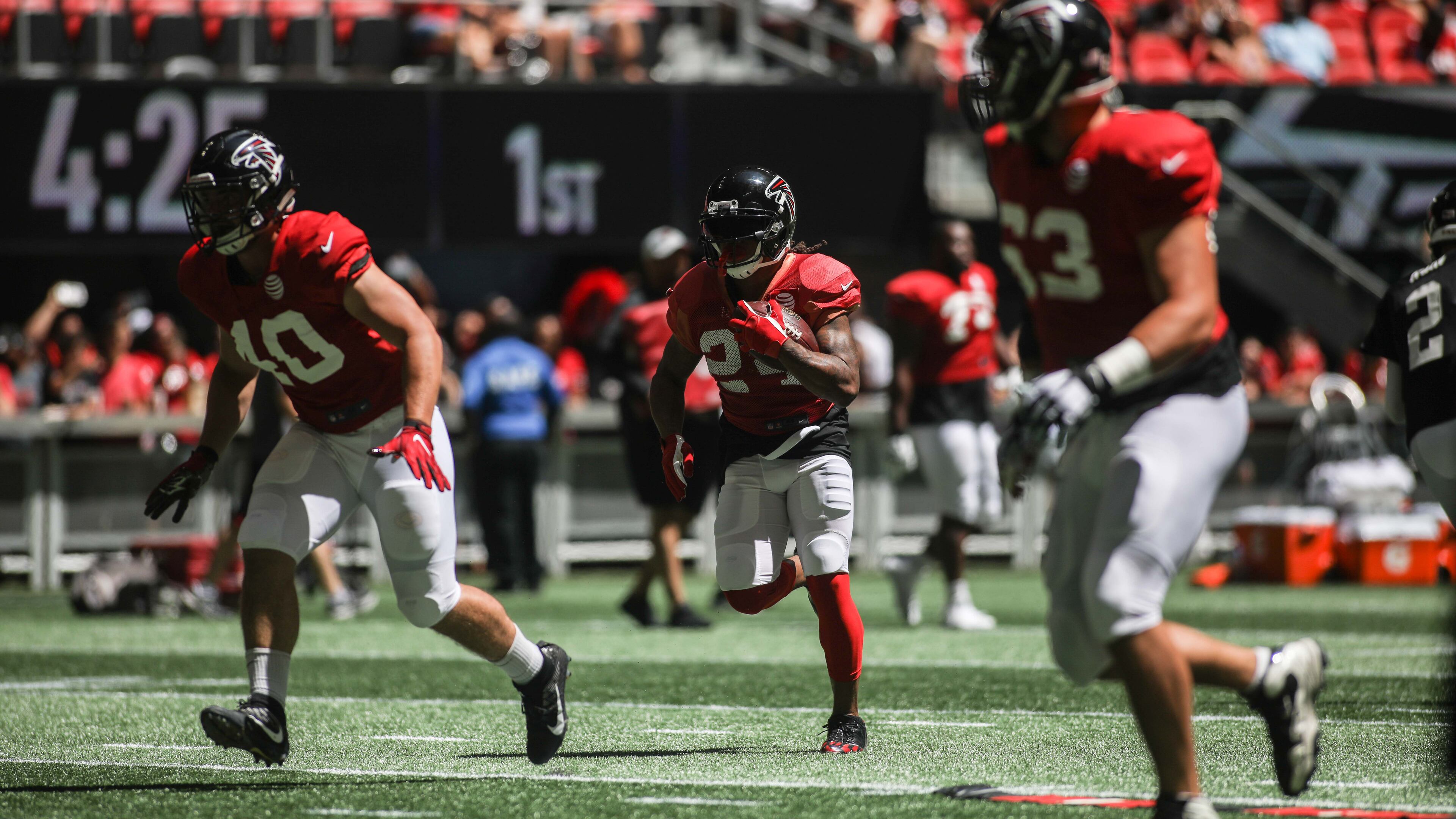 Atlanta Falcons fullback Daniel Marx (40), running back Devonta Freeman (24) and offensive guard Ben Garland (63) during open practice Sunday, July 29, 2018, at Mercedes-Benz Stadium in Atlanta.