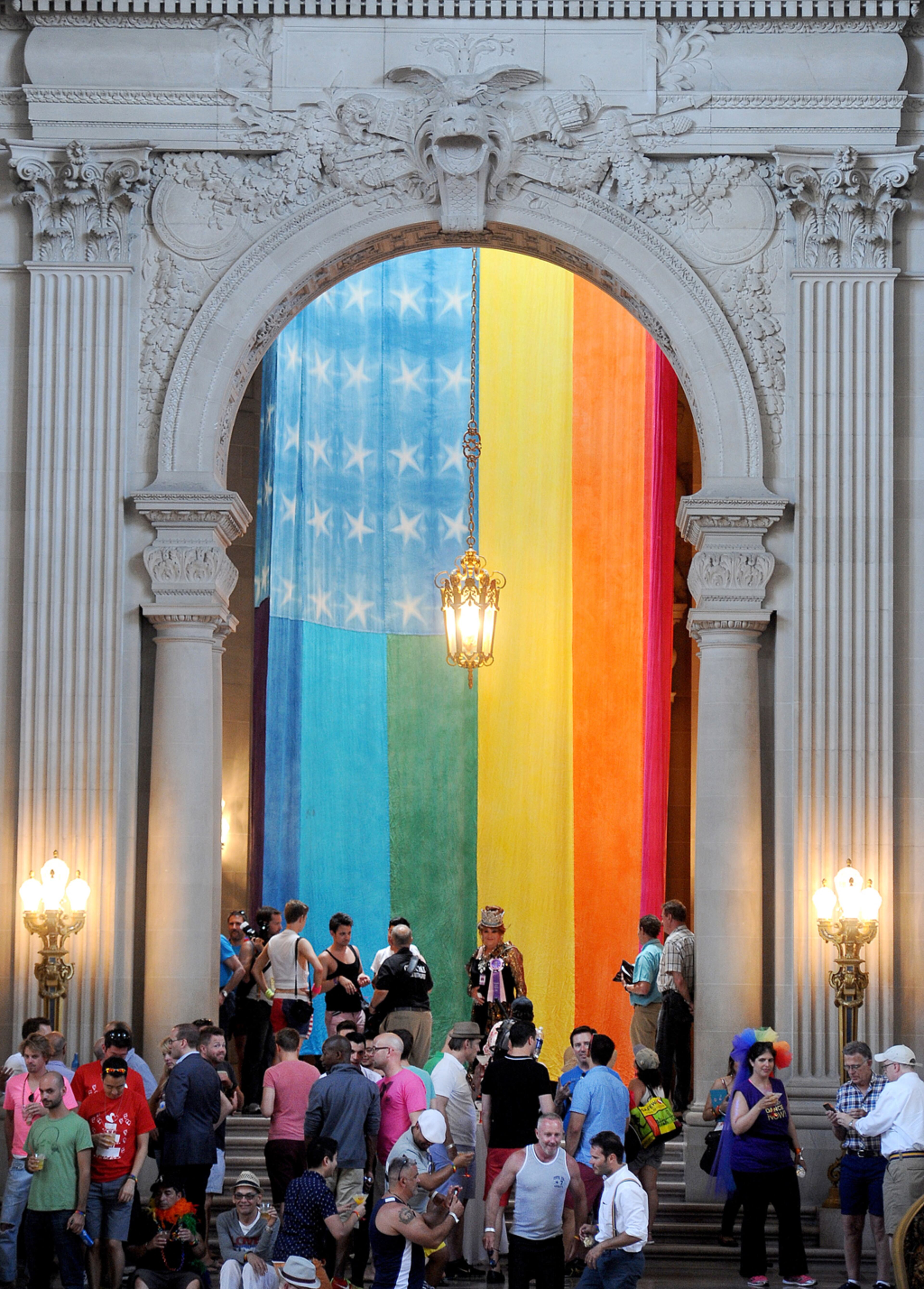 A rainbow flag hangs inside San Francisco's City Hall during gay pride celebrations Sunday, June 30, 2013. (AP Photo/Noah Berger)