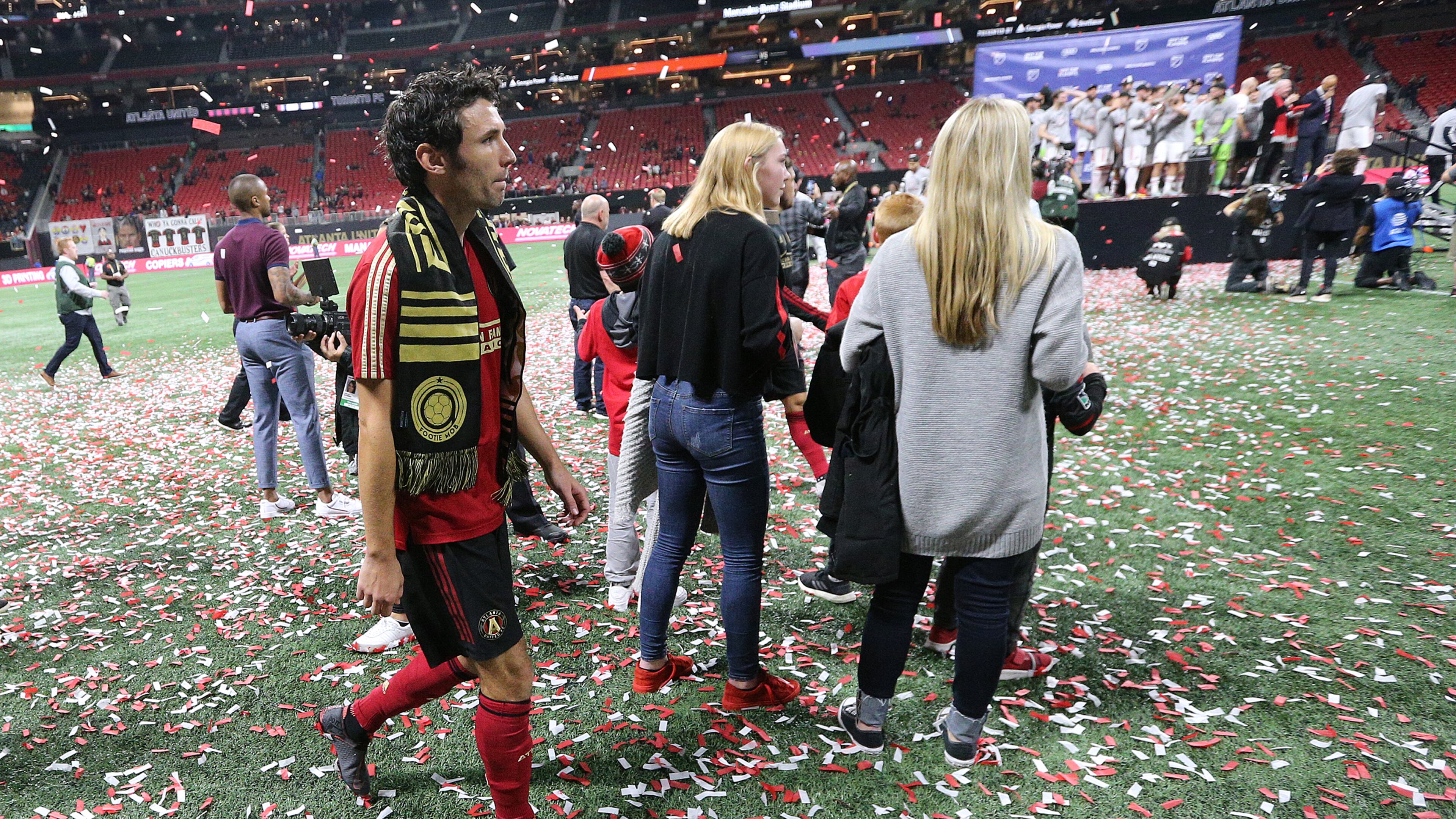 October 30, 2019 Atlanta: Atlanta United defender Michael Parkhurst, who is retiring, walks off the field after his final game while Toronto FC celebrates a 2-1 victory during the trophy presentation in the Eastern Conference Final on Wednesday, October 30, 2019, in Atlanta. Curtis Compton/ccompton@ajc.com