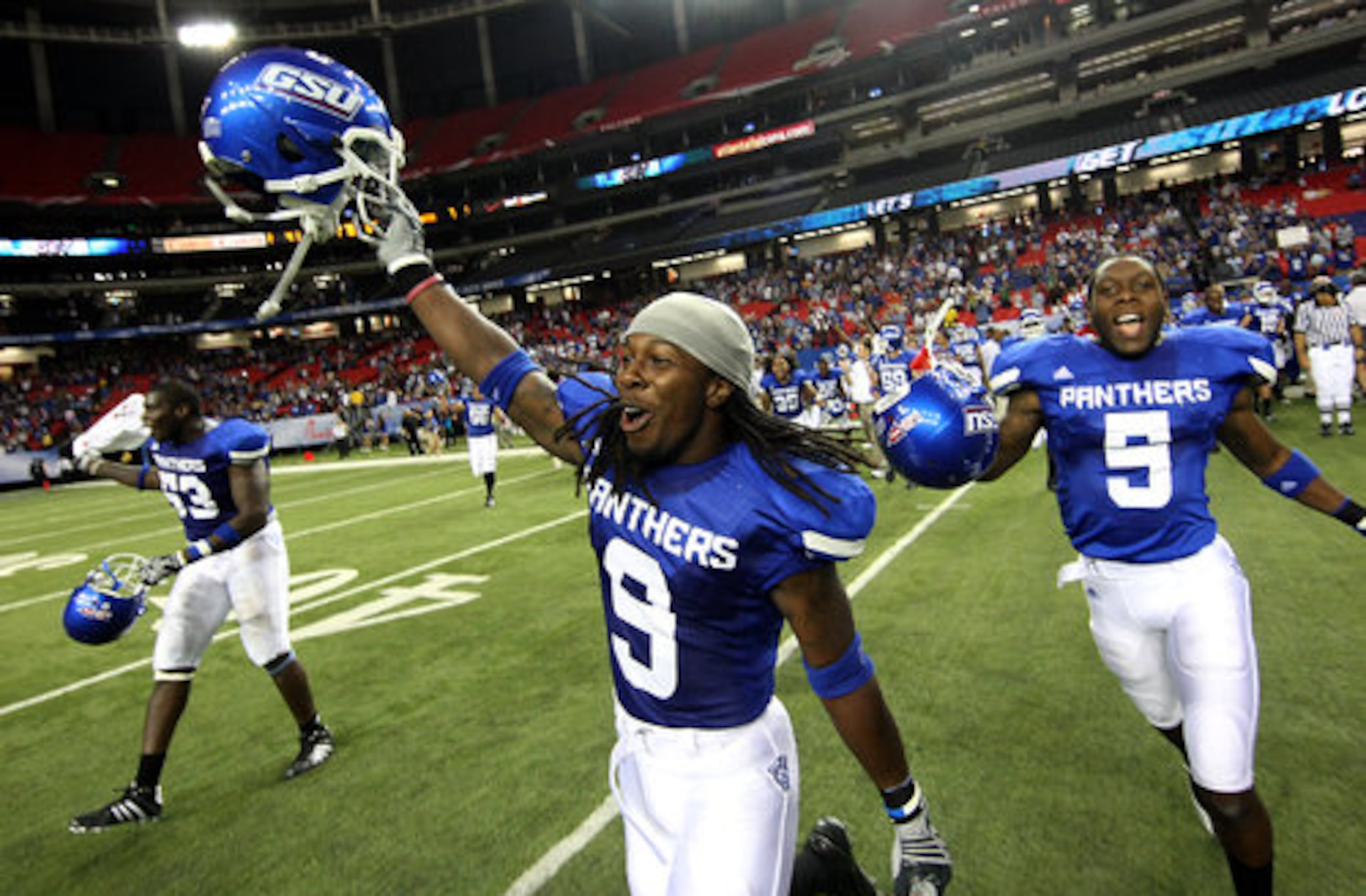 Georgia State University cornerback Brent McClendon (9) and Demarius Matthews (5) race onto the field moments after their 41-7 win over Shorter College for their first ever win in the Georgia Dome Thursday night in Atlanta, Ga., Sept. 2, 2010.
