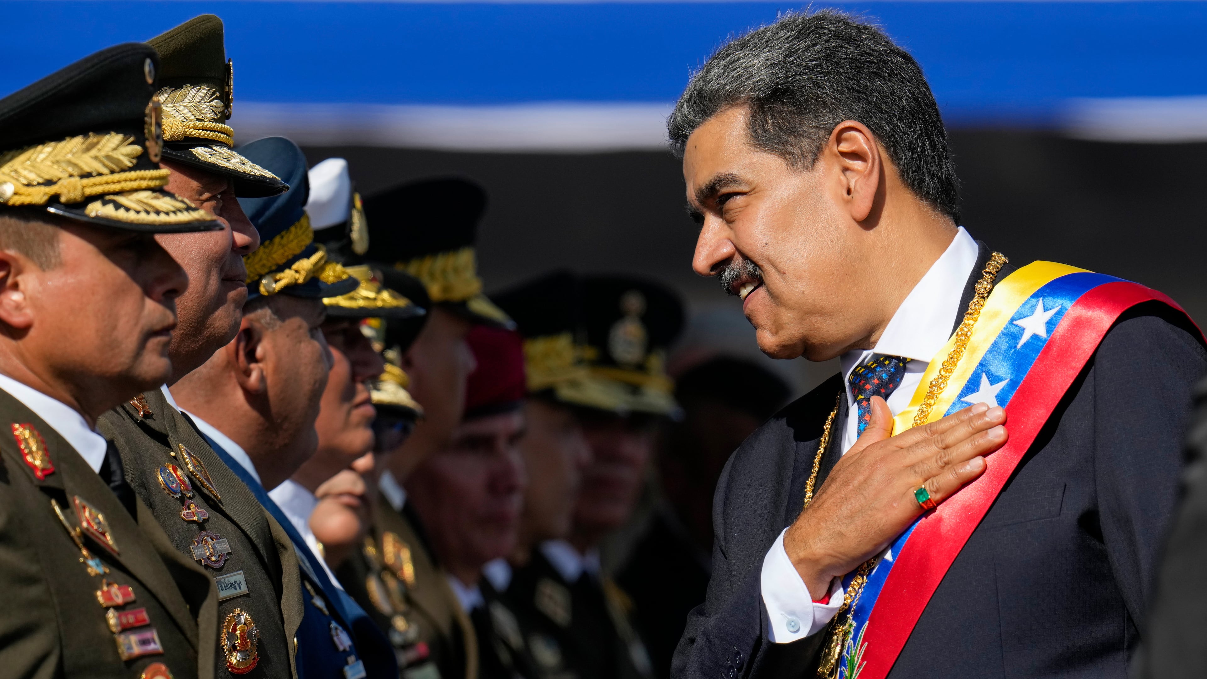 FILE - Venezuela's President Nicolas Maduro places his hand over his hear while talking to high-ranking officers during a military ceremony on his inauguration day for a third term, in Caracas, Venezuela, Jan. 10, 2025. (AP Photo/Ariana Cubillos, File)