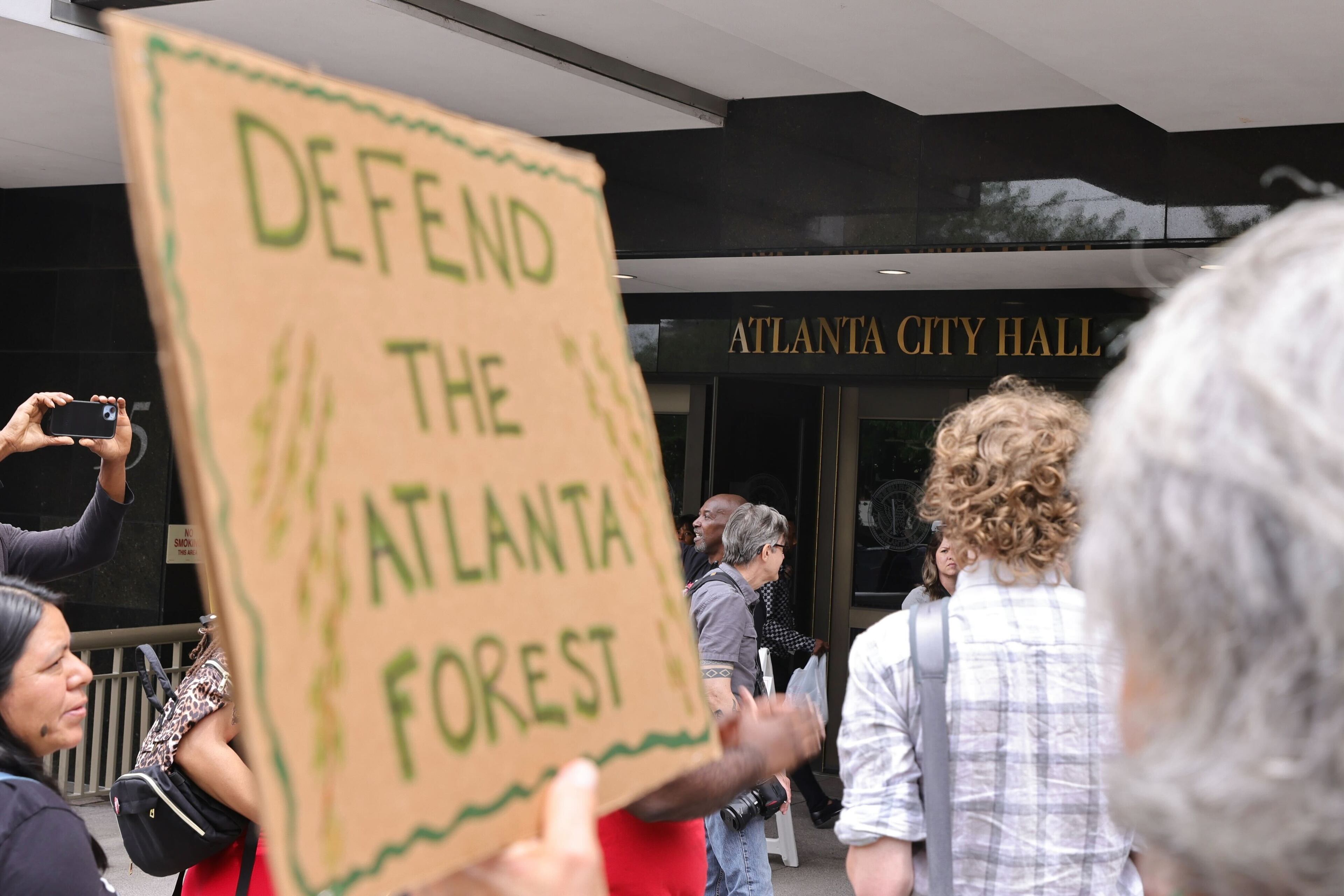 Protesters gather outside Atlanta City Hall ahead of the final vote to approve legislation that funds the training center on Monday, June 5, 2023. (Natrice Miller / natrice.miller@ajc.com)