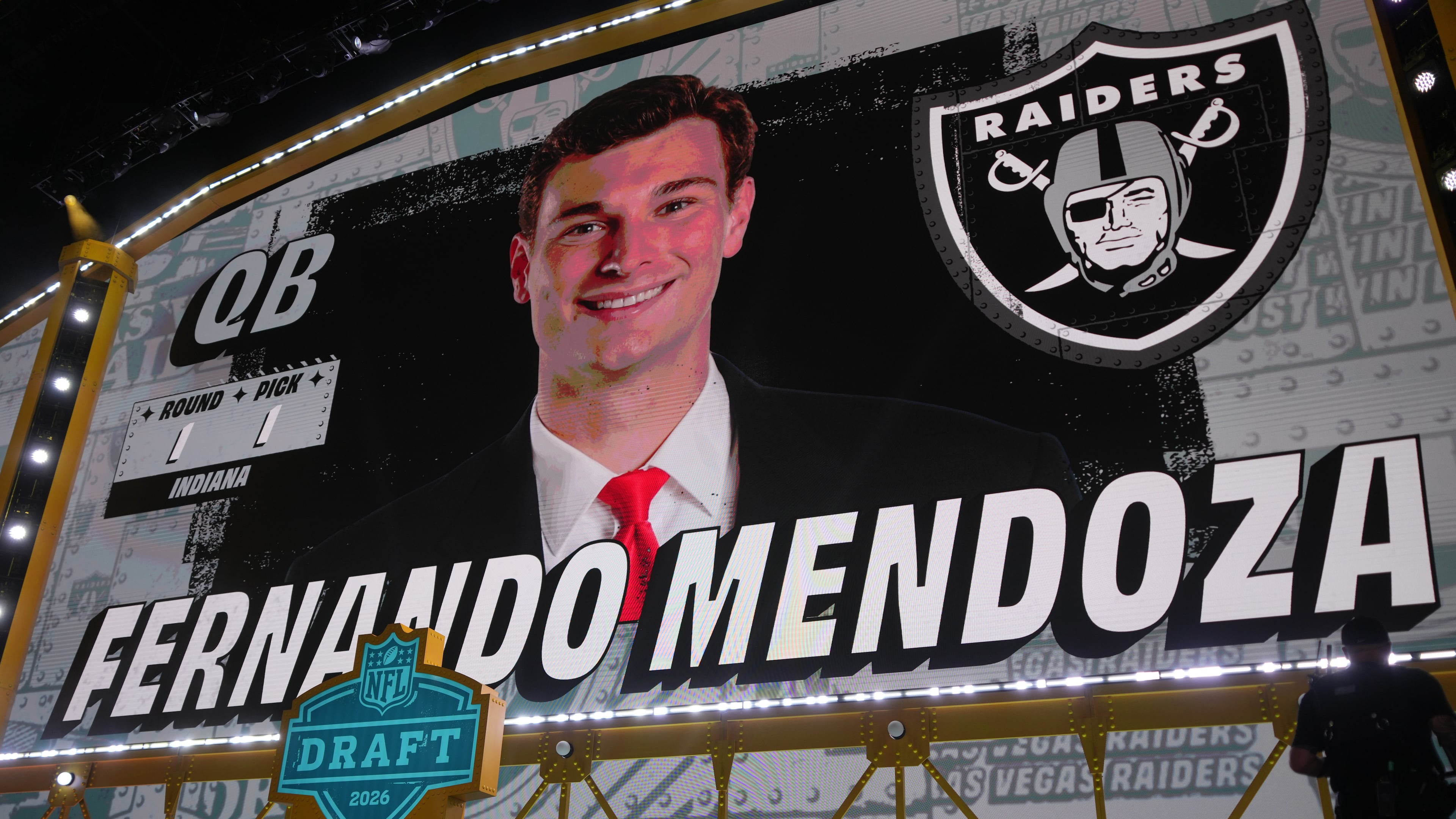 Indiana quarterback Fernando Mendoza is shown on a screen after being chosen by the Las Vegas Raiders with the first overall pick during the first round of the NFL football draft, Thursday, April 23, 2026, in Pittsburgh. (AP Photo/Gene J. Puskar)