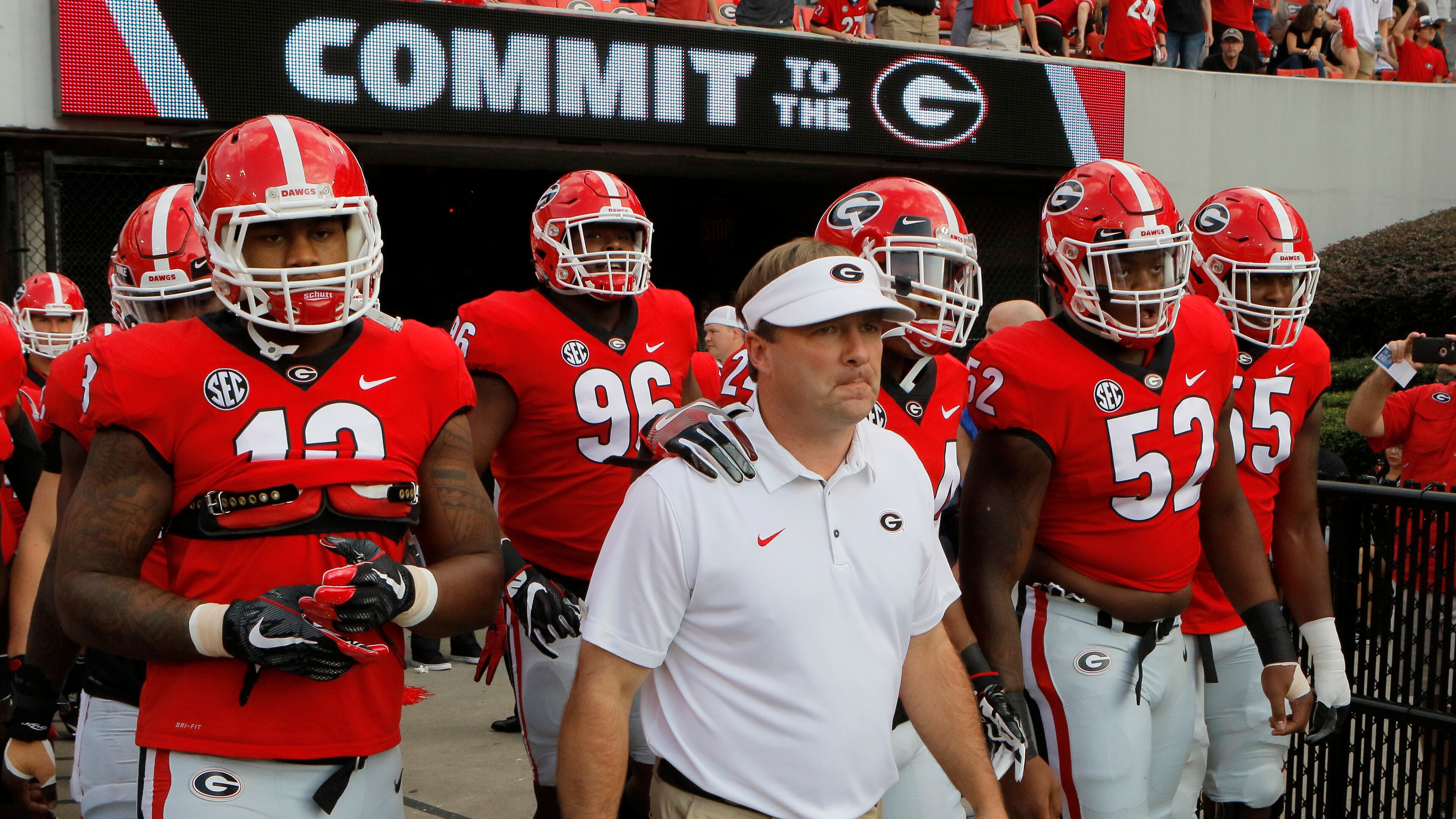 Georgia head coach Kirby Smart leads his team to the field for warmups before a NCAA college football game in Athens against Mississippi State. BOB ANDRES /BANDRES@AJC.COM