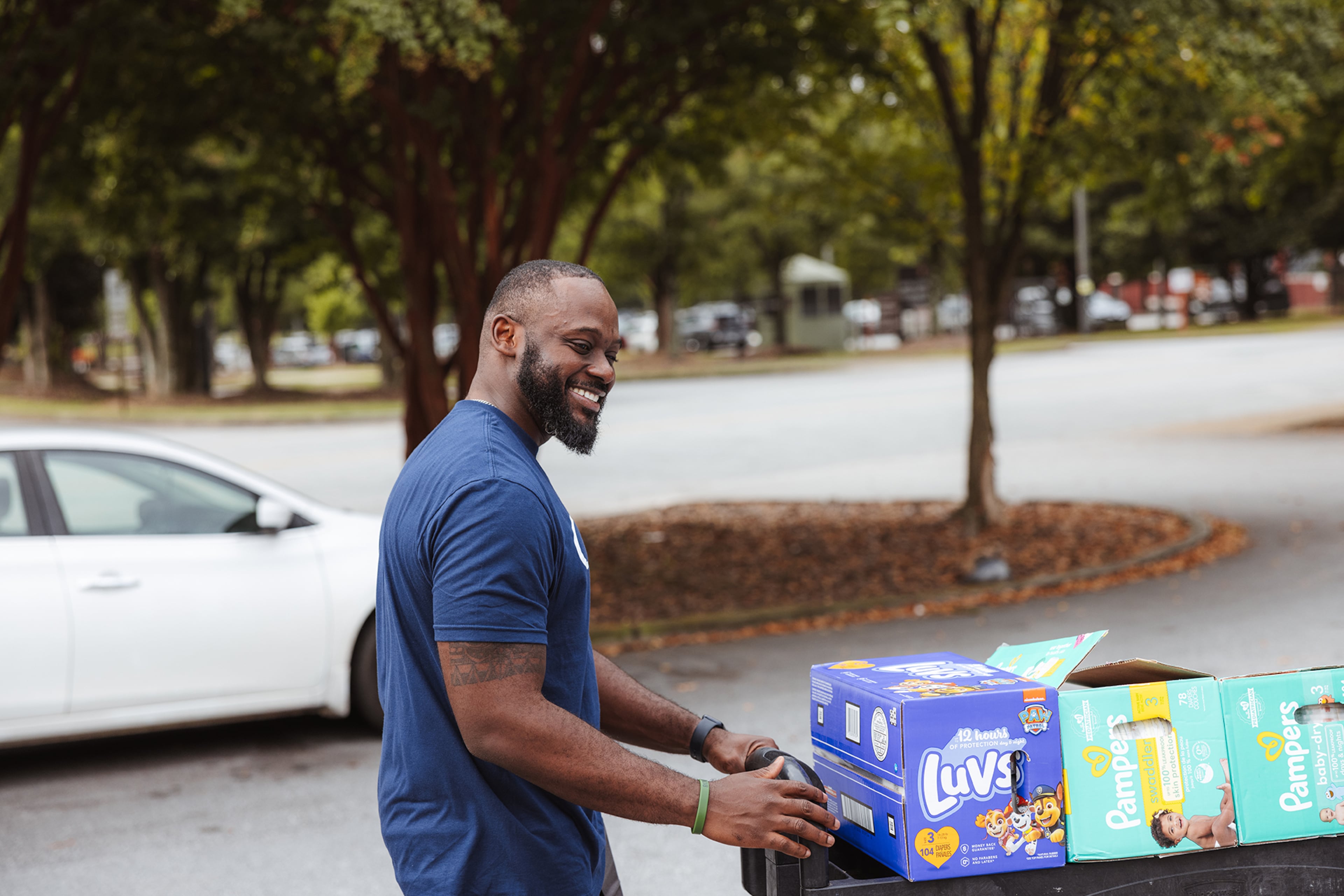A volunteer helps organize baby products at a day of service for Our House.
(Courtesy of Our House)