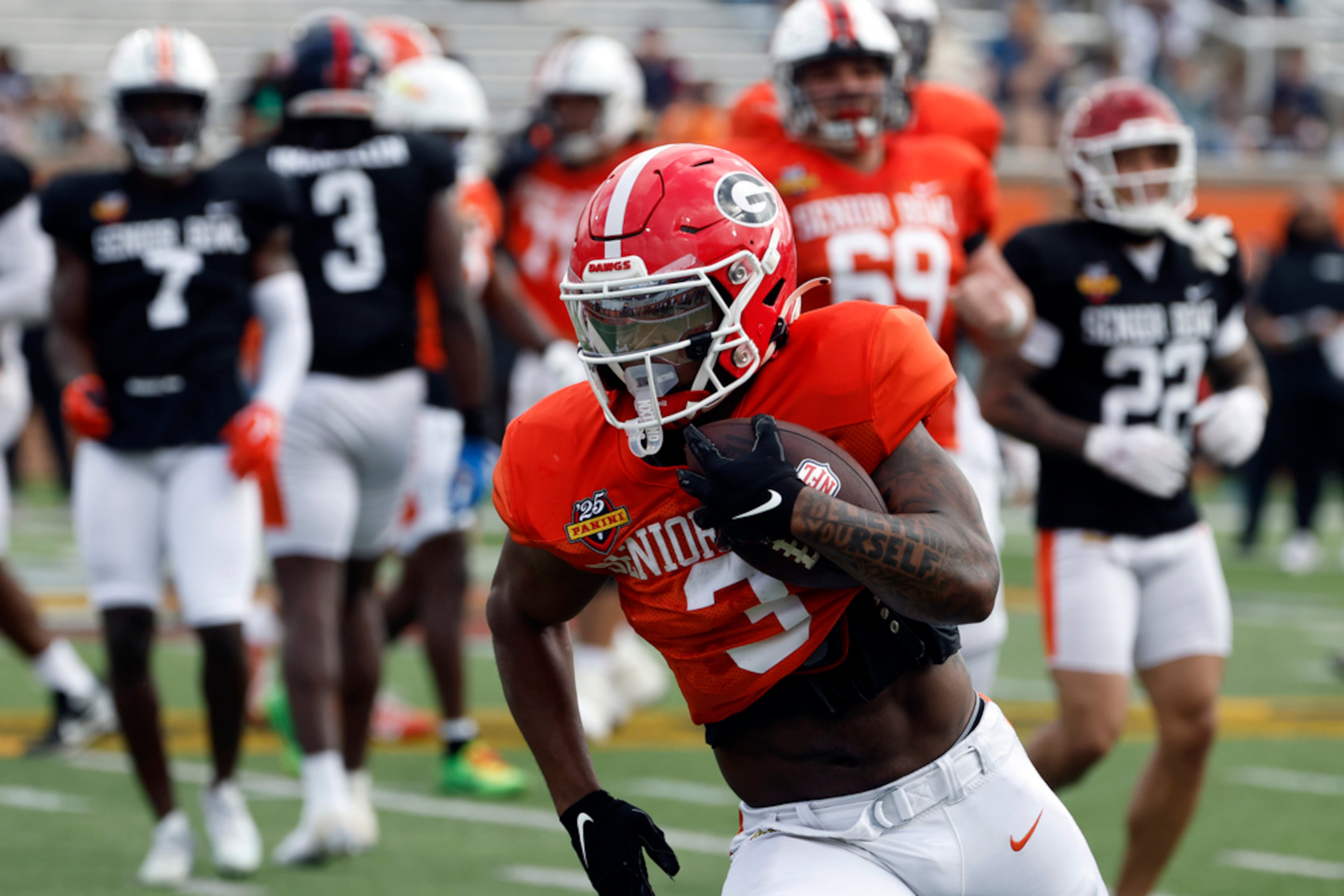 American team running back Trevor Etienne of Georgia (3) runs through drills during practice for the Senior Bowl NCAA college football game, Thursday, Jan. 30, 2025, in Mobile, Ala. (AP Photo/Butch Dill)