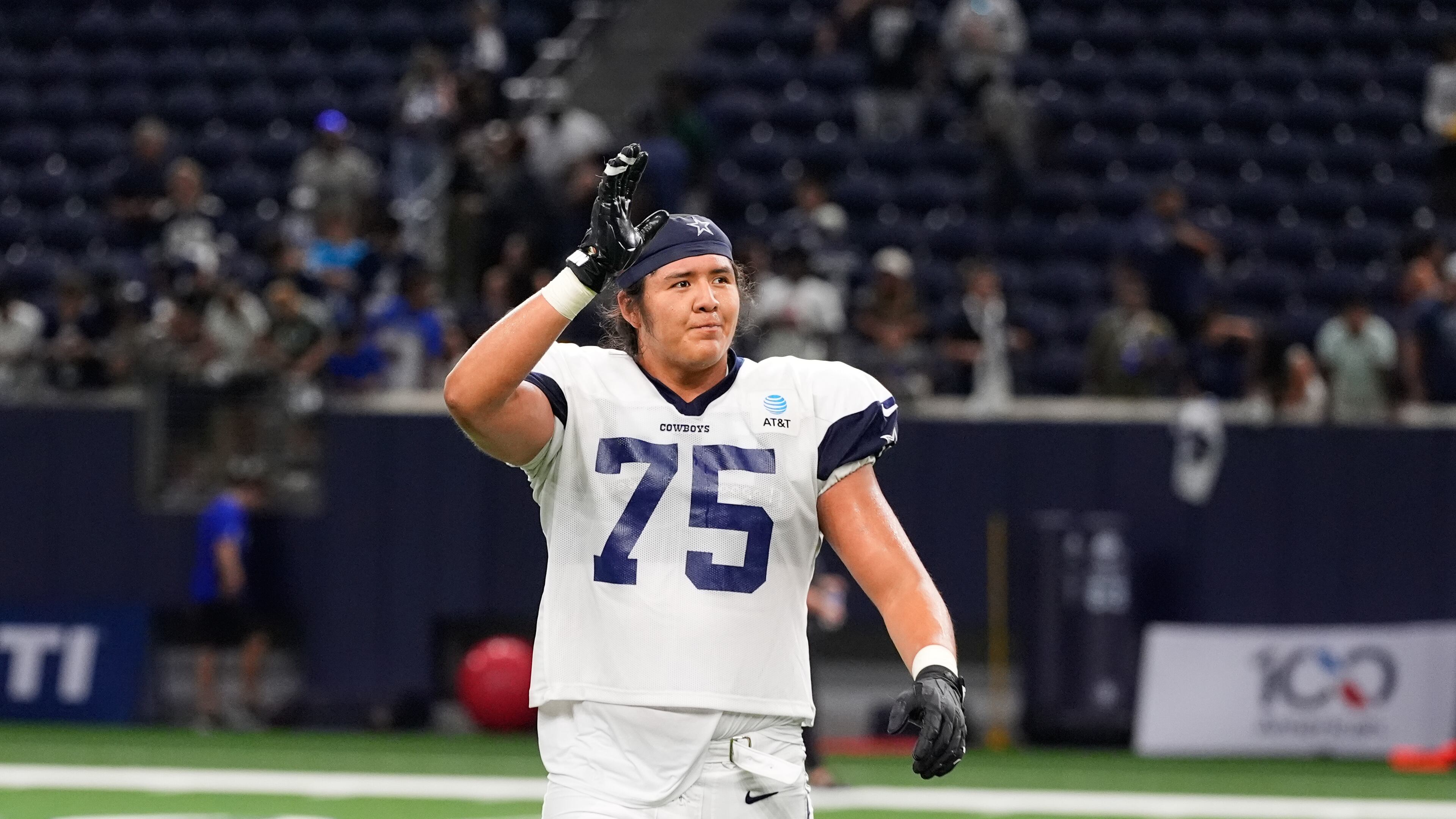 FILE - Dallas Cowboys offensive tackle Shiyazh Pete waves to fans after an NFL football practice on Aug. 26, 2026, in Frisco, Texas. (AP Photo/Tony Gutierrez, File)