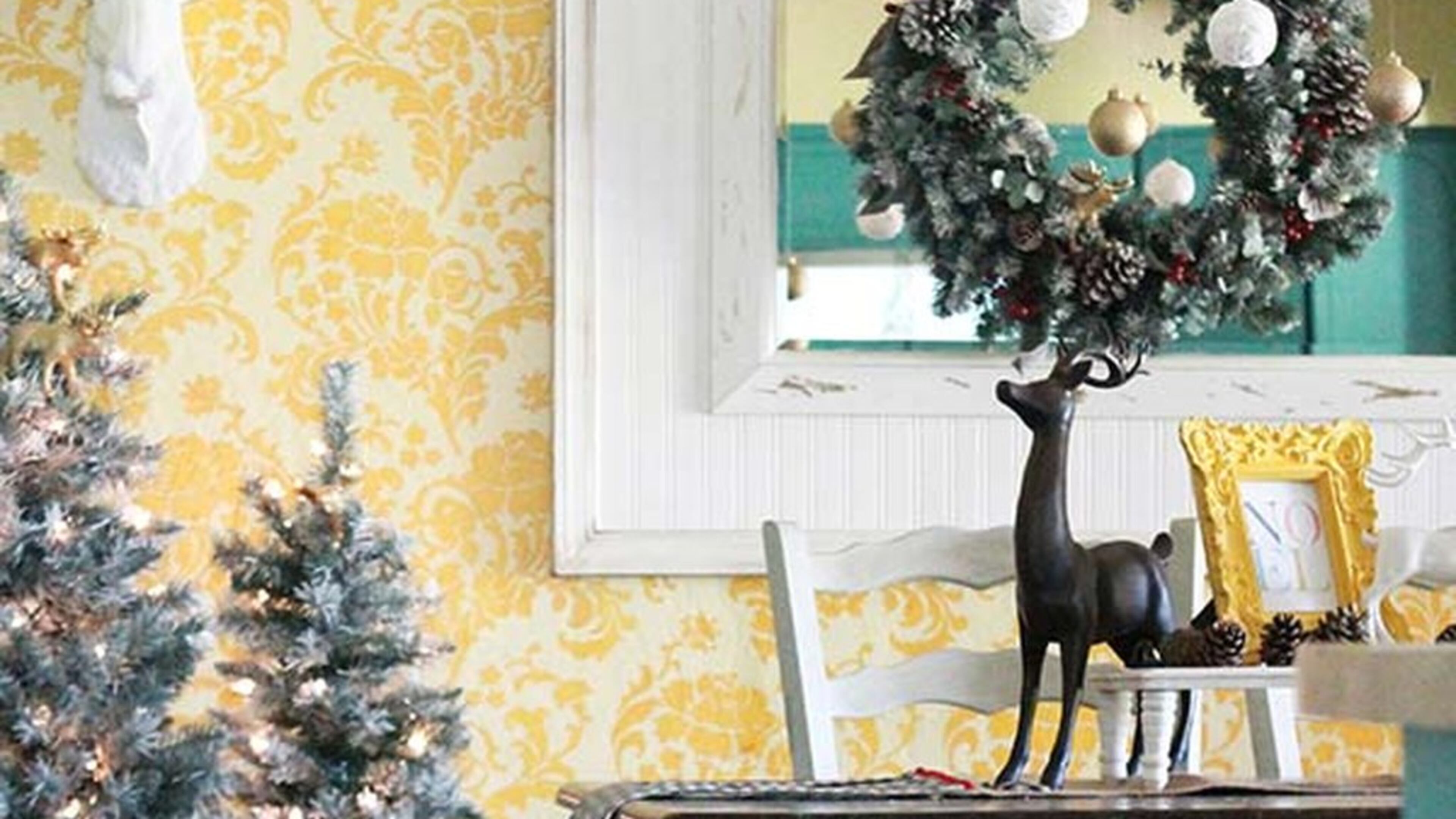 DIY Bloggers Kelli Mullins and Kristi Jansen have avoided the traditional red and green holiday palette for a few years now, instead opting for a cheery look that incorporates their year-round yellow and turquoise decor. By adding a hint of winter with DIY white yarn ornaments and trees, which you can find on their blog, Lolly Jane, and pulling the yellow of their usual decor in with golds, the duo mix sunshine and holiday vibes seamlessly. CONTRIBUTED BY: LollyJane.com