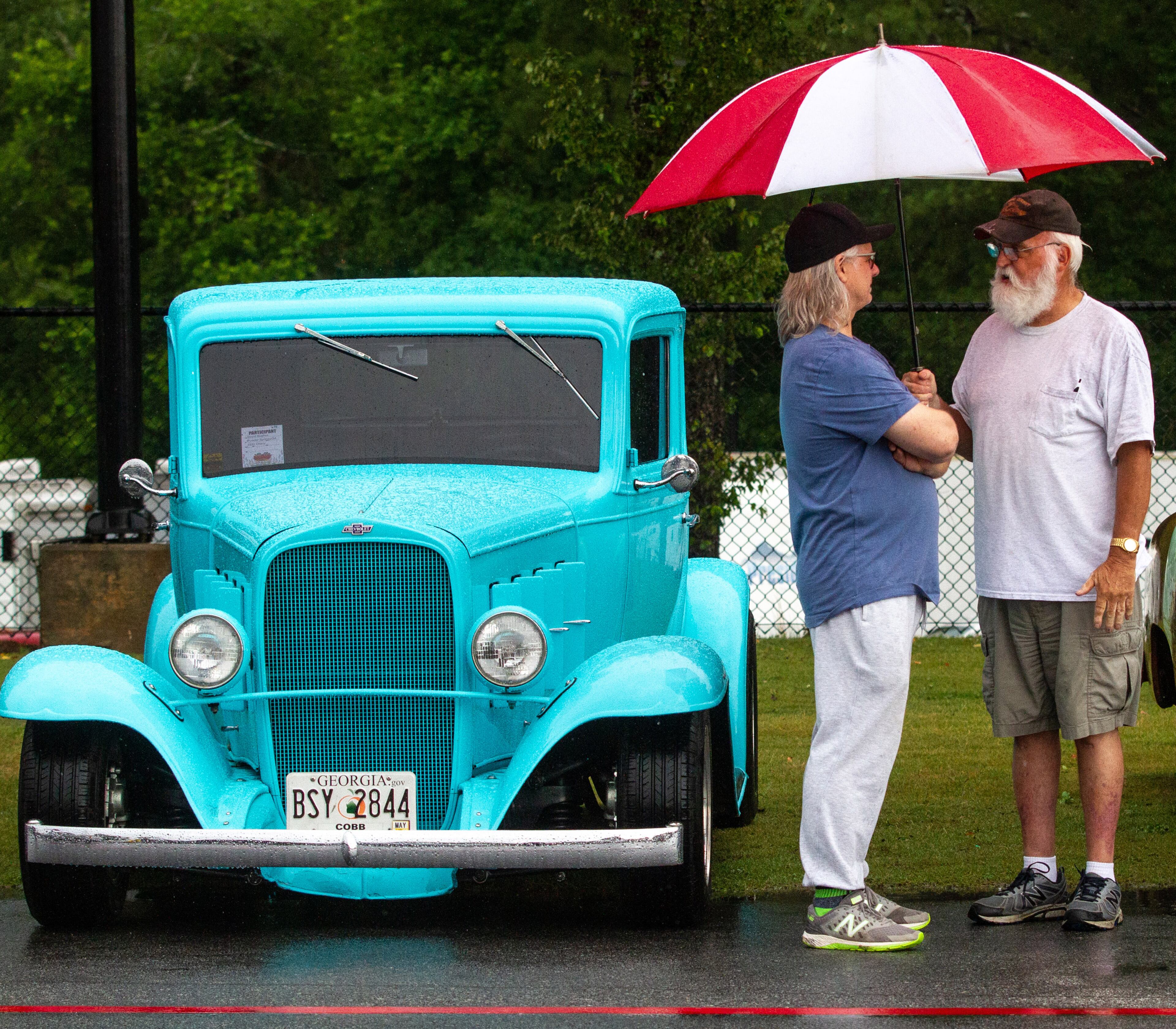 Jeff Caudell (L) talks to David Hughes during the Creepers Car Club’s 29th annual charity show in Marietta on Sunday, June 8, 2019. STEVE SCHAEFER / SPECIAL TO THE AJC