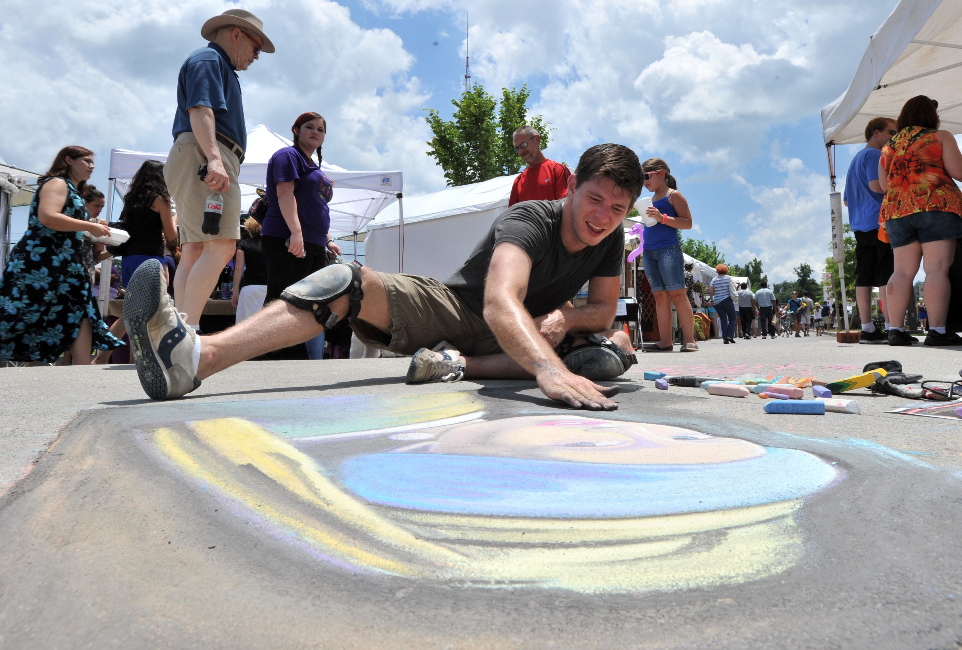Atlanta artist Adam Wellborn draws the famous Dutch painting "Girl With a Pearl Earring" during the Old Fourth Ward Park Arts Festival in the Historic Fourth Ward Park in Atlanta on Saturday, June 29, 2013.