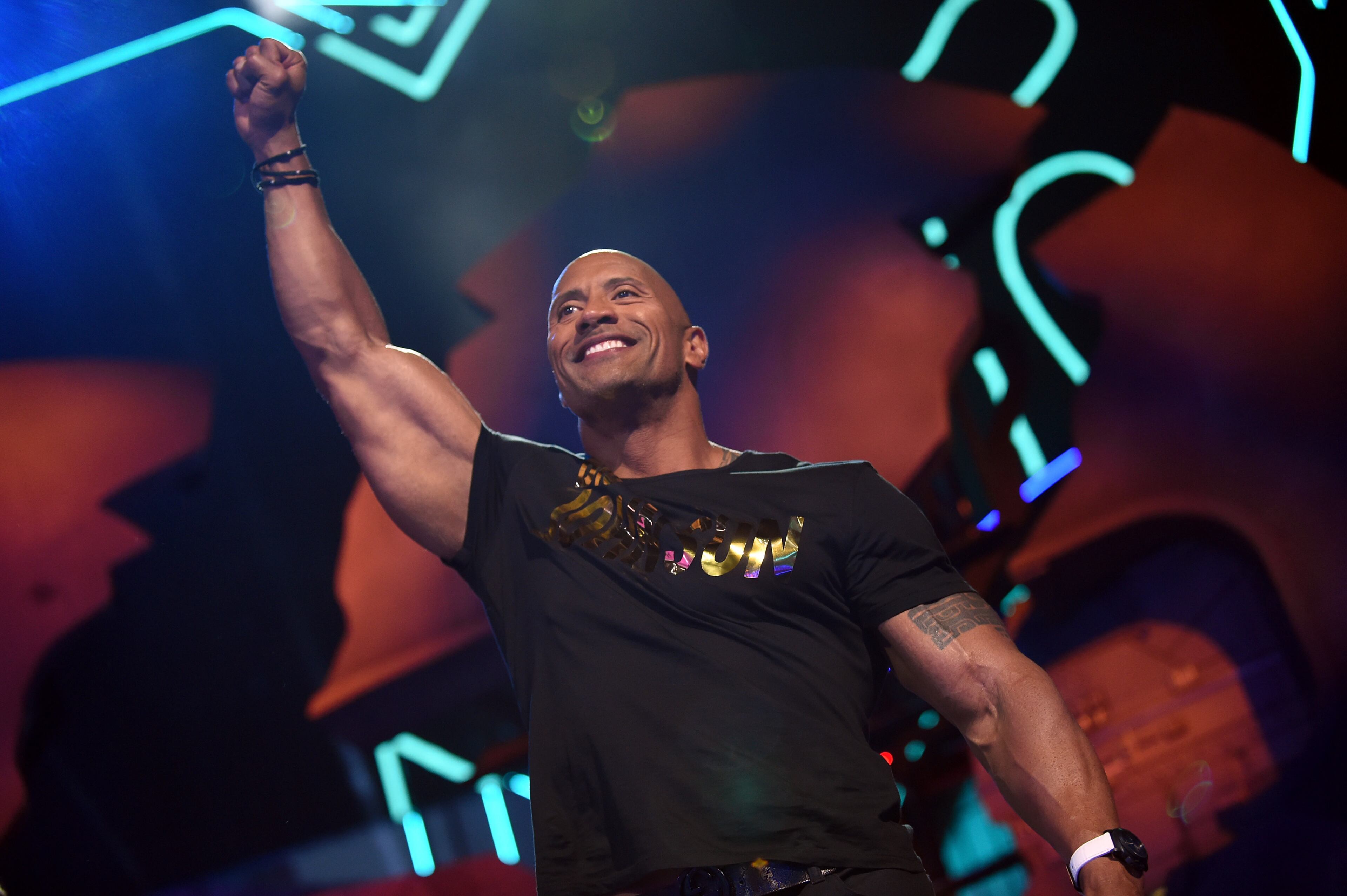 BURBANK, CALIFORNIA - APRIL 09: Host Dwayne Johnson speaks onstage during the 2016 MTV Movie Awards at Warner Bros. Studios on April 9, 2016 in Burbank, California. MTV Movie Awards airs April 10, 2016 at 8pm ET/PT. (Photo by Emma McIntyre/Getty Images for MTV)