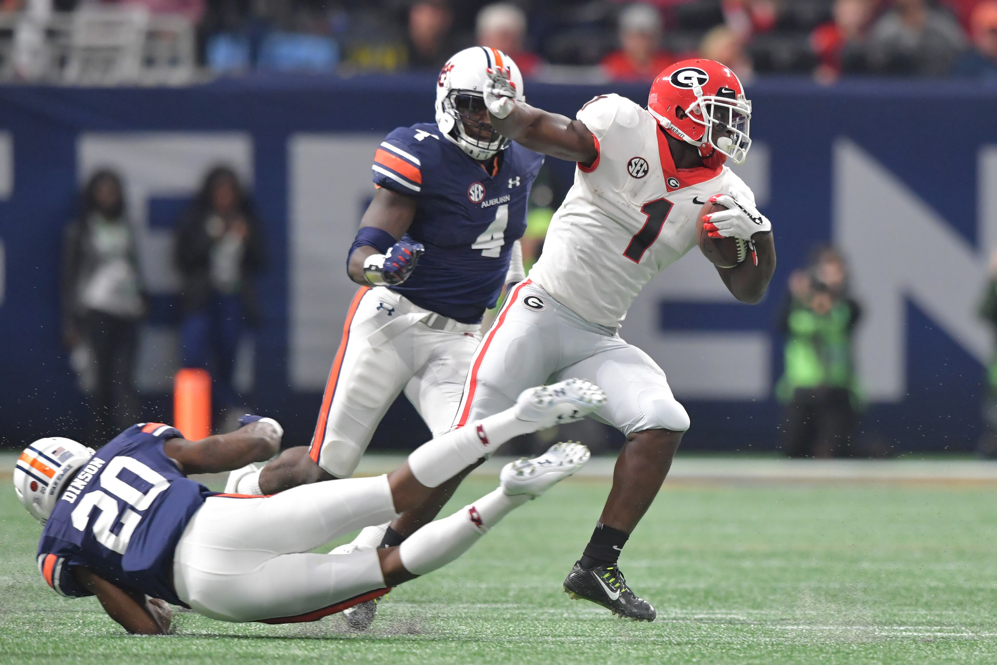 December 2, 2017 Atlanta: Georgia Bulldogs running back Sony Michel (1) breaks away from Auburn Tigers defensive back Jeremiah Dinson (20) during the first half of the SEC Football Championship at Mercedes-Benz Stadium, December 2, 2017, in Atlanta. Hyosub Shin / hshin@ajc.com