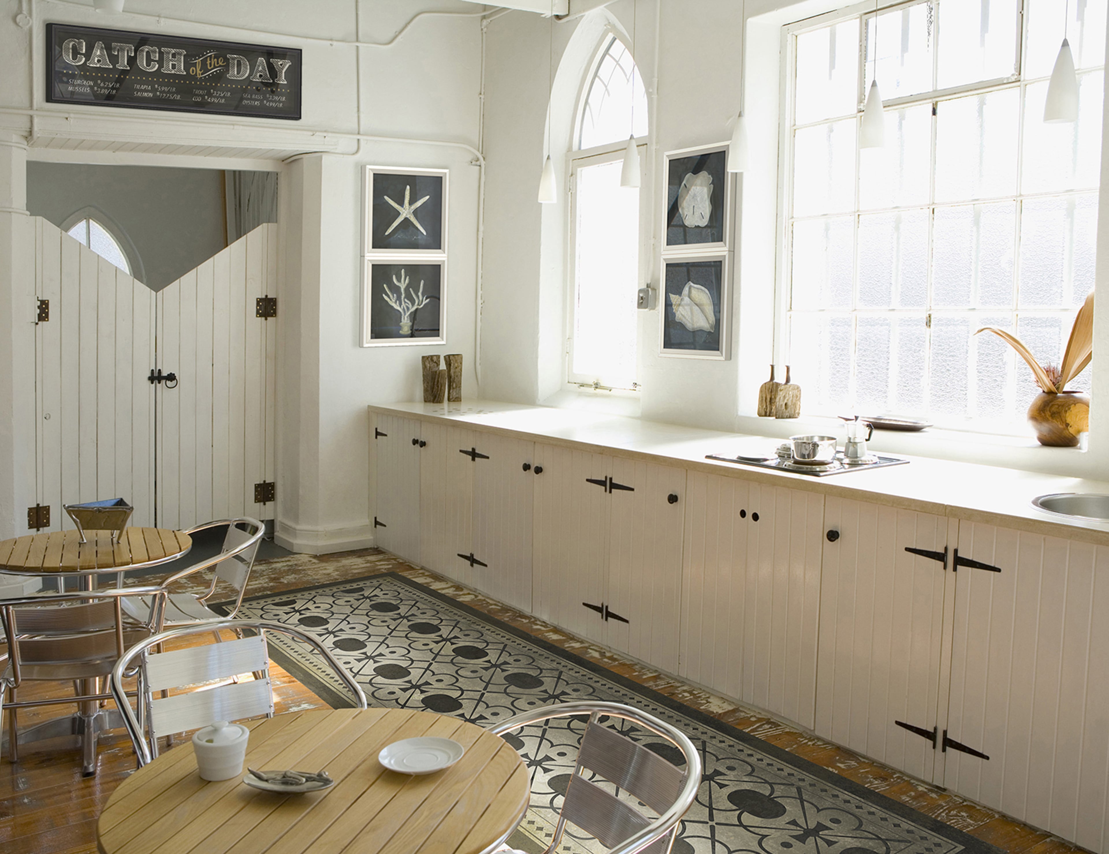 Non-slip vinyl floorcloths are perfect for kitchens, dining and outdoor spaces. The Holmes design by Spicher and Company’s is available in various room sizes. (Goodshoot)