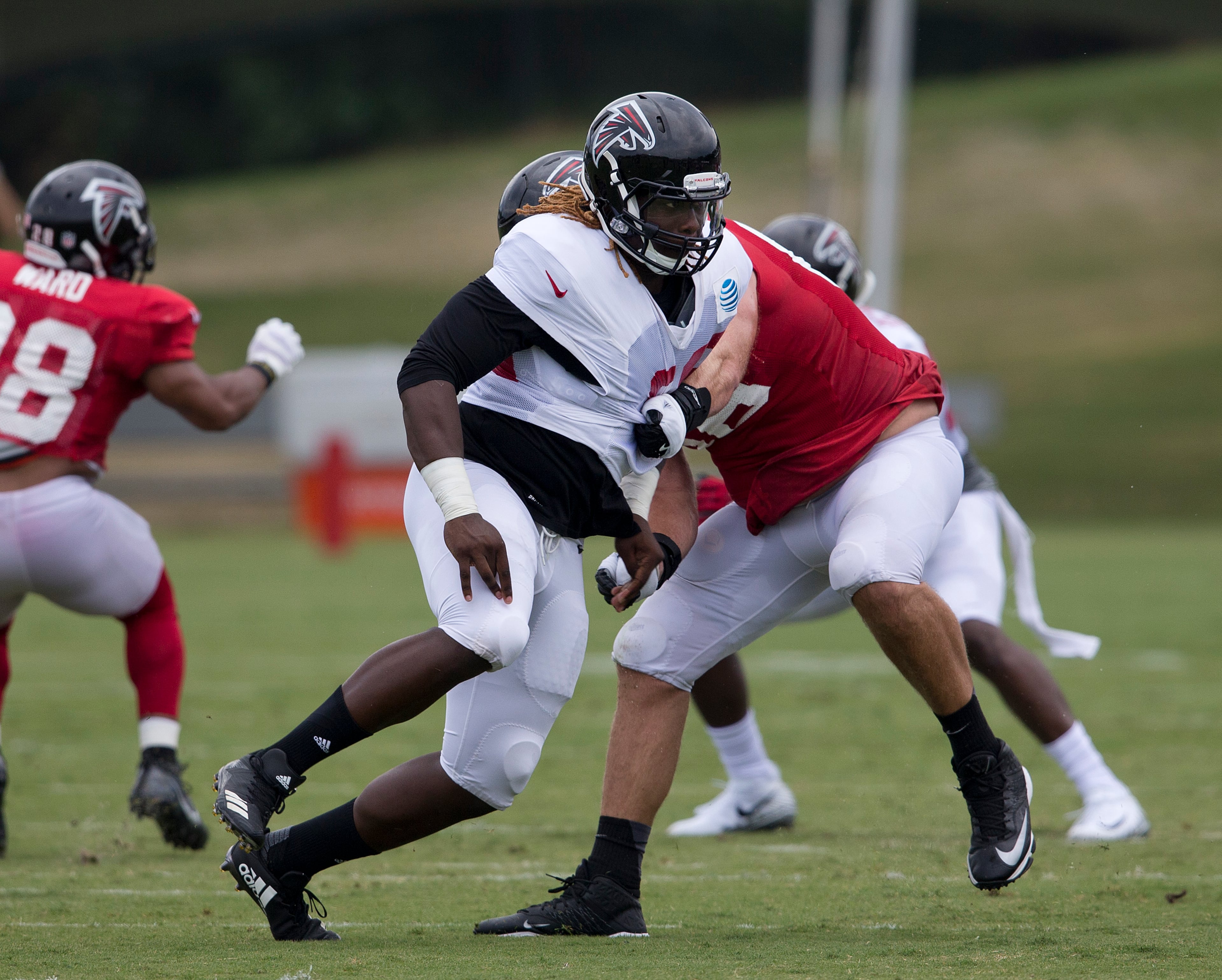 Rookie defensive end Takk McKinley (left) works against offensive tackle Kevin Graf (66) during Wednesday's training camp practice.