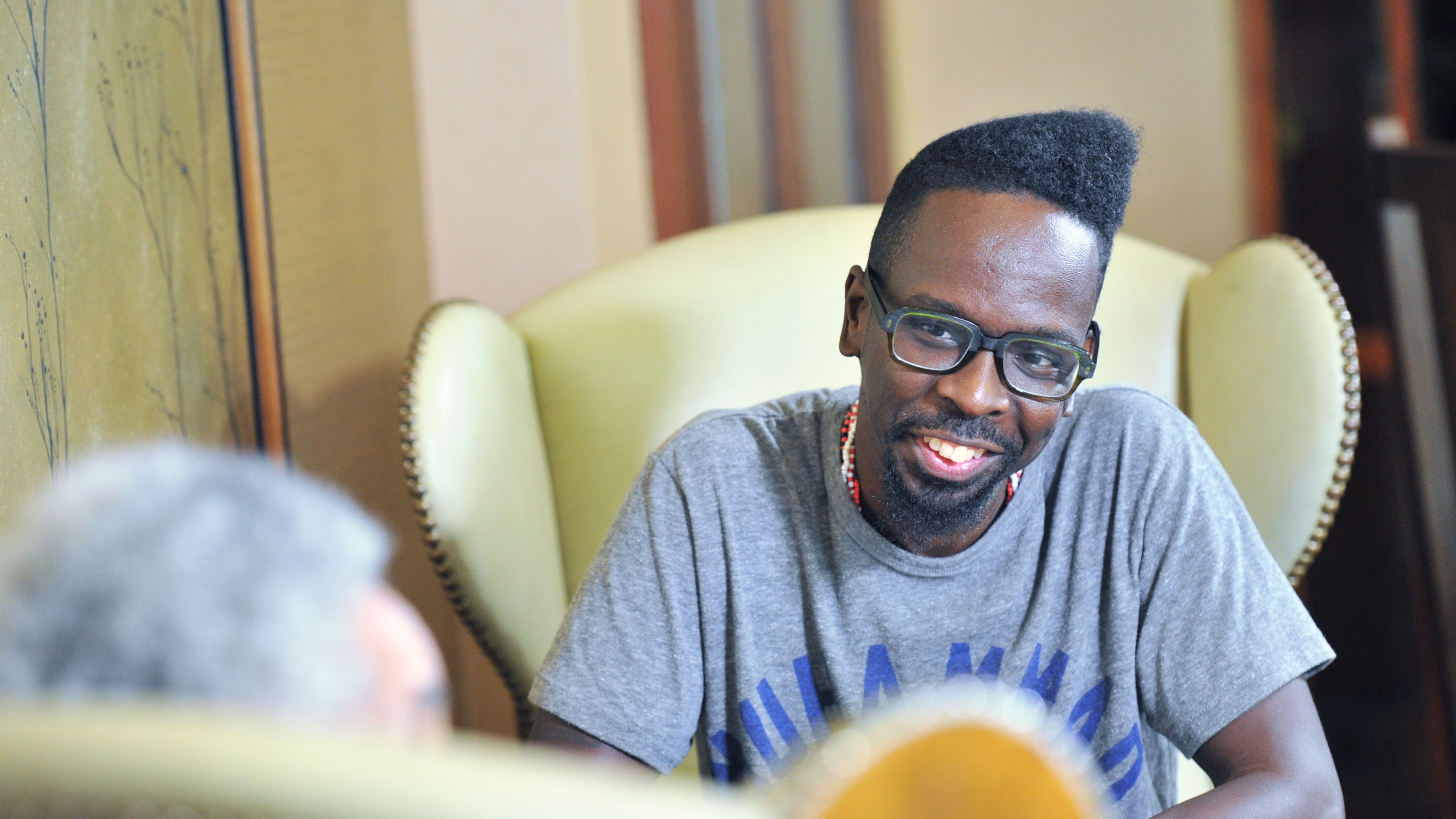 September 15, 2016 Atlanta - Atlanta based artist Fahamu Pecou reacts as he listens to filmmaker, sculptor and provocateur Camille Billops (foreground) at Emory University Conference Center Hotel on Thursday, September 15, 2016. Both have made careers exploring black identity and representation in art. Pecou’s work is in the permanent collection of the new Smithsonian African American musuem, Billops’ work is taught in colleges around the country. HYOSUB SHIN / HSHIN@AJC.COM