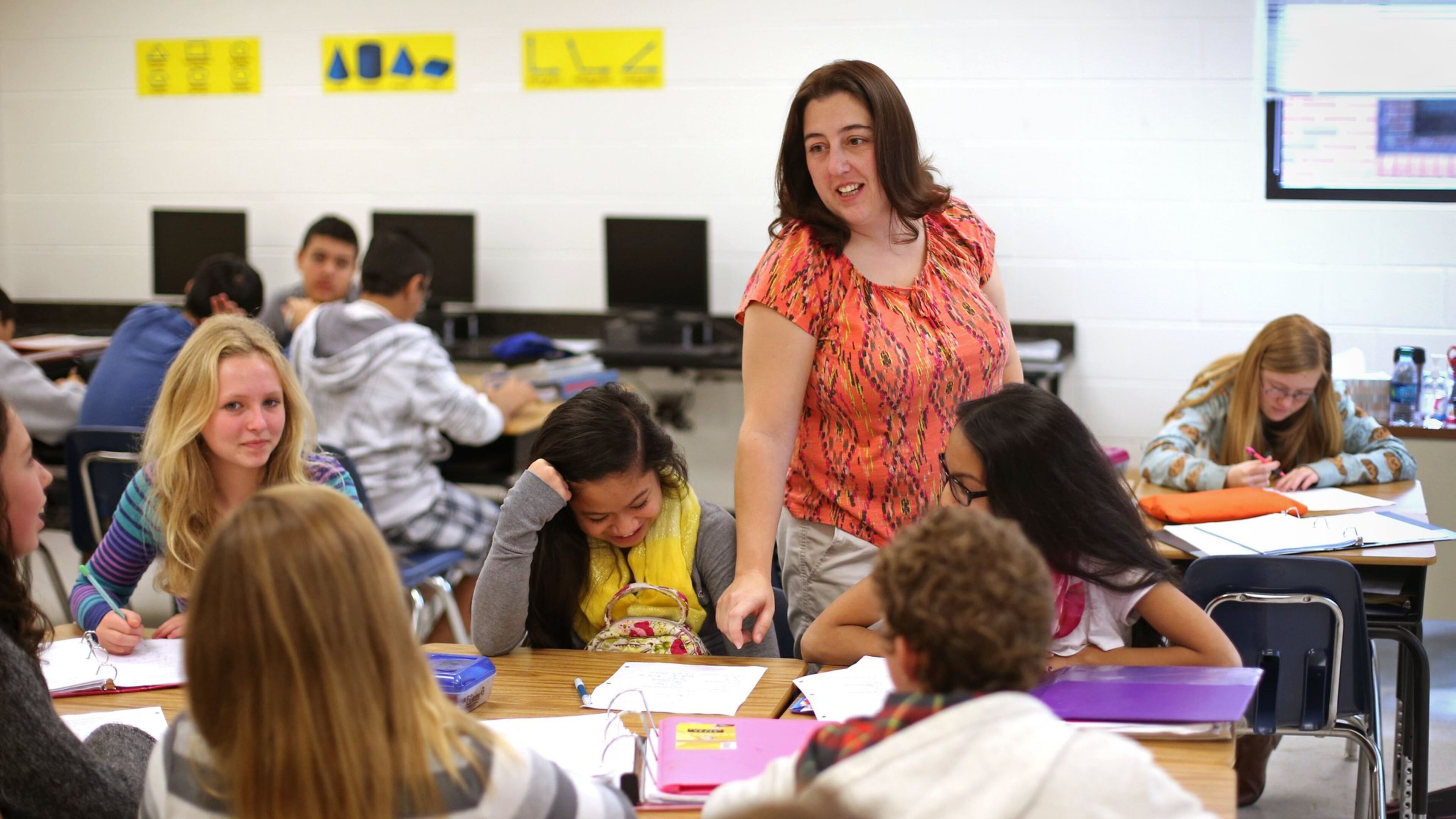 Eighth grade math teacher Amanda Wilhelm instructs a group of students in Math 8 at ET Booth Middle School Wednesday morning in Woodstock.