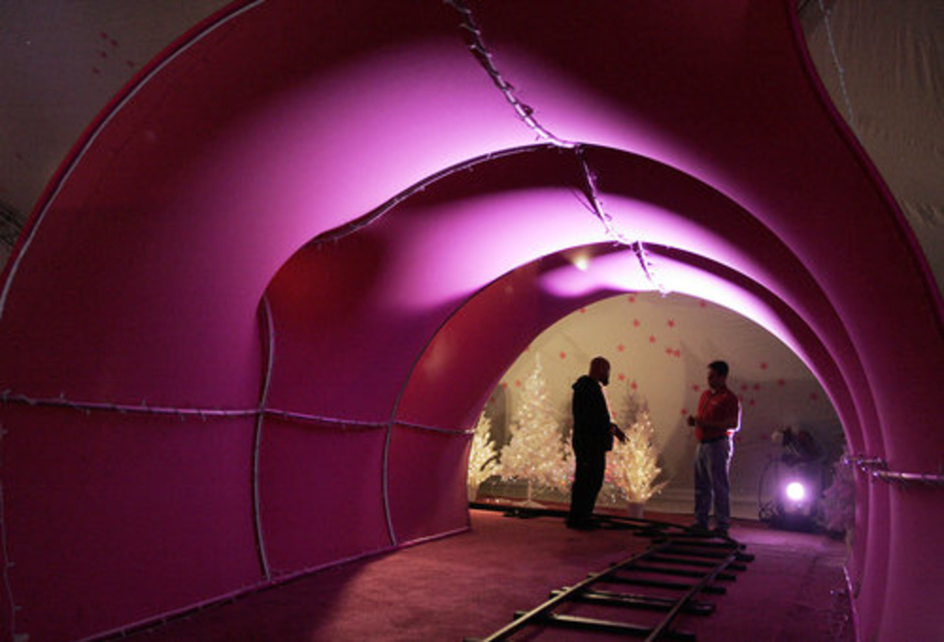 Alex Richard and Tony Rhodes talk at the end of a tunnel. The ride opens to the public Saturday, Nov. 7, and runs through Jan. 3. It is closed Thanksgiving and Christmas.