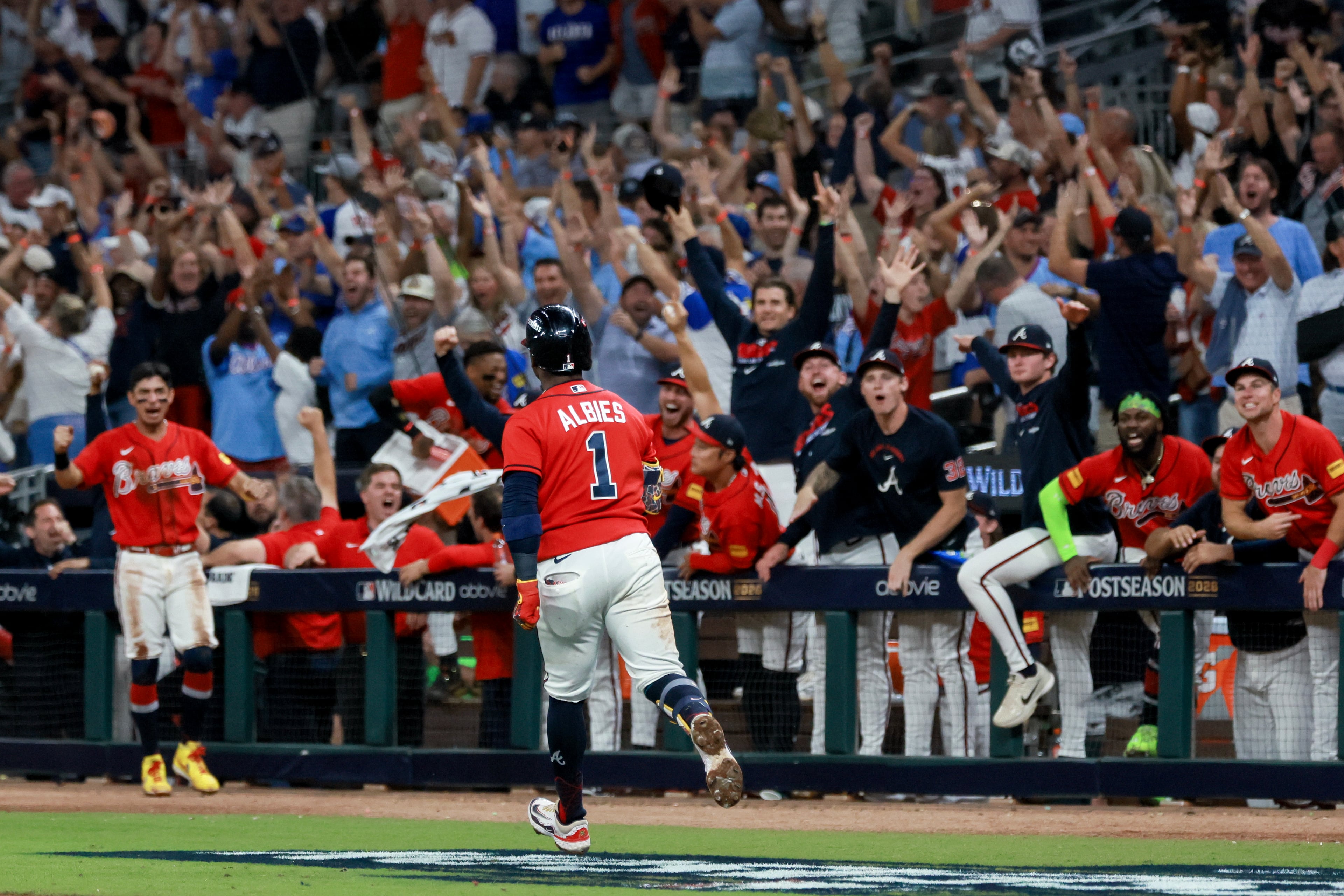 Braves second baseman Ozzie Albies rounds the bases after hitting a two-run home run against the Phillies during Game 3 of their NL Wild Card Series on Thursday, Oct. 1, 2026, in Atlanta. (Jason Getz/AJC)