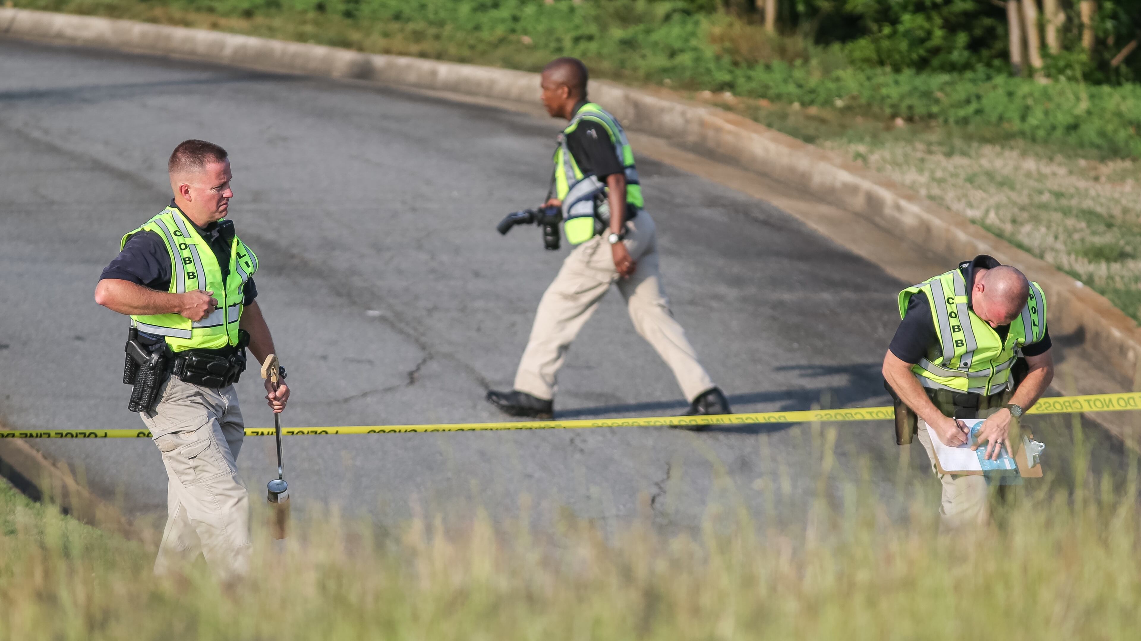 The bizarre series of events began Wed., May 11, 2016, on Cobb Parkway near Bells Ferry Road in Cobb County, where a woman hit and killed a pedestrian, Cobb police Officer Alicia Chilton said. JOHN SPINK / JSPINK@AJC.COM