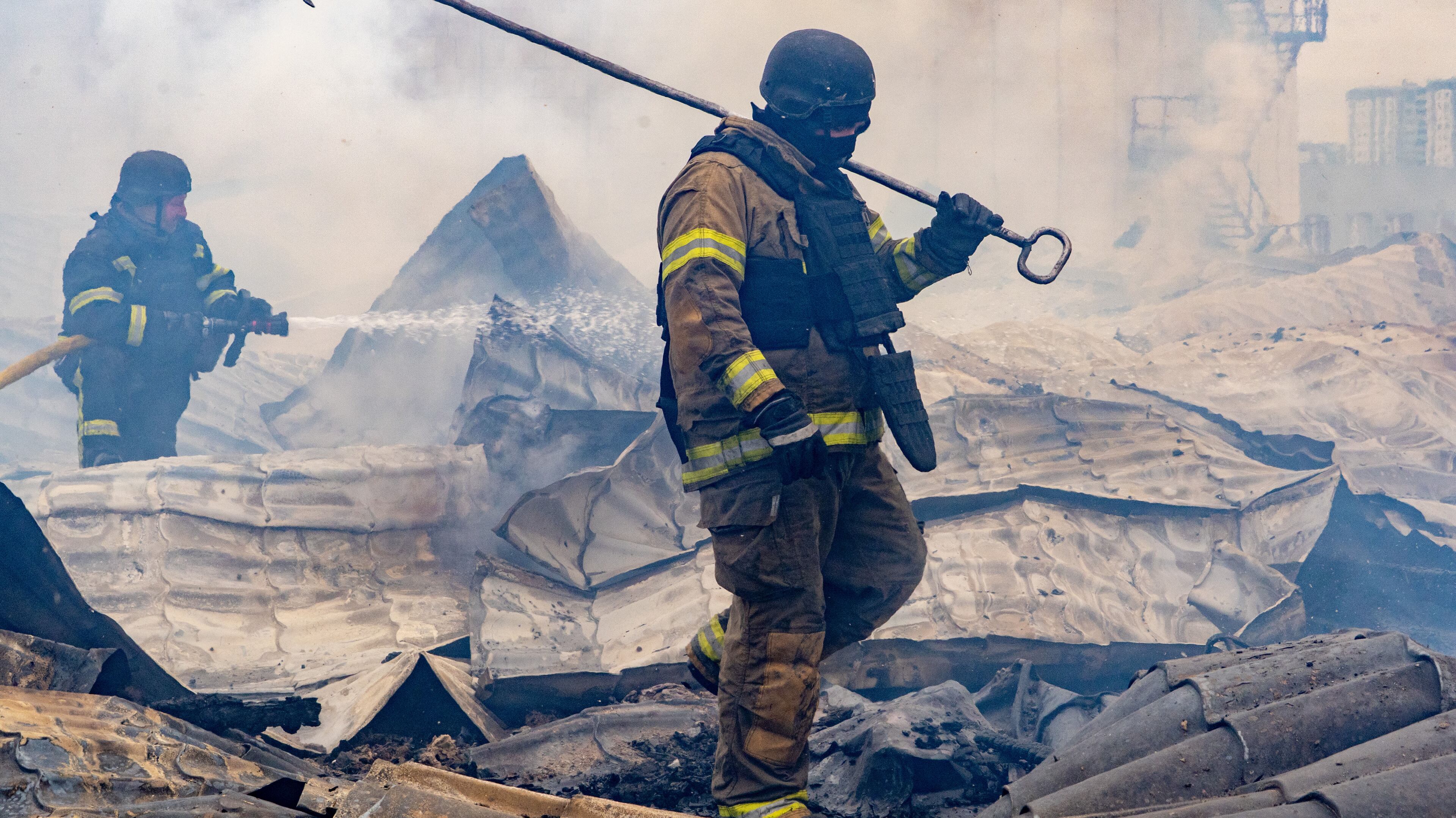 Rescuers work on the roof of a damaged building following Russia's air attack in Kharkiv, Ukraine, Friday, Oct. 23, 2026. (AP Photo/Andrii Marienko)