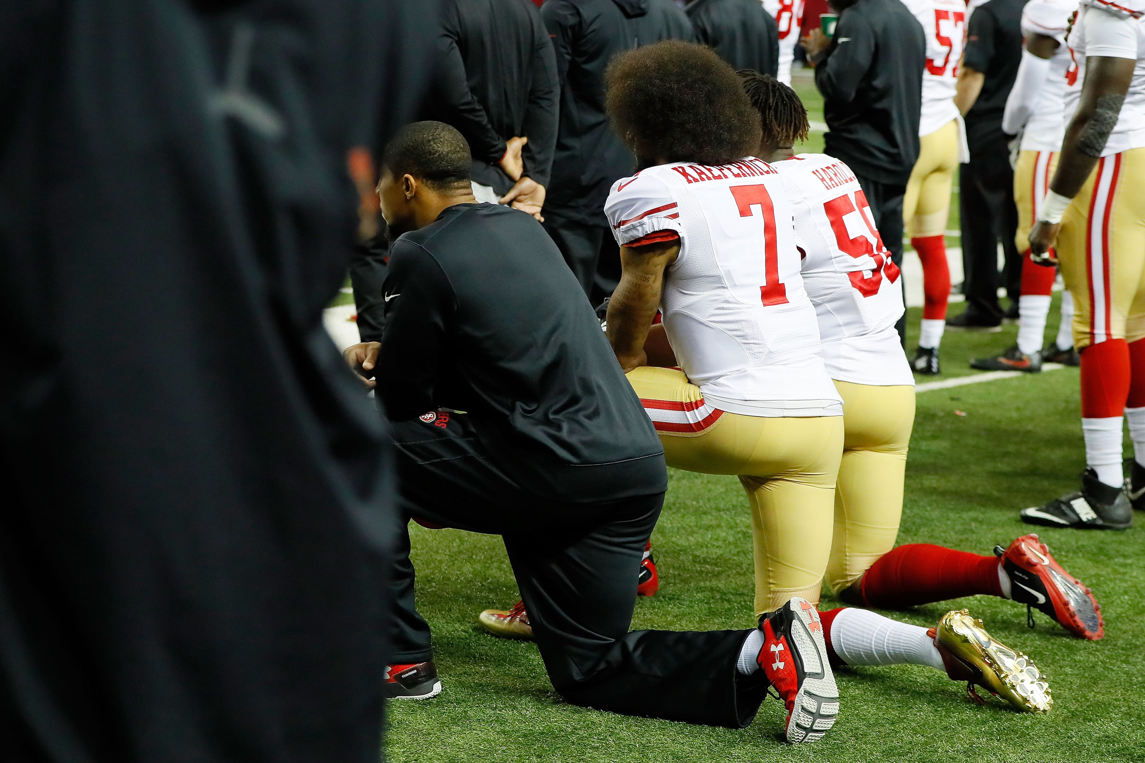 ATLANTA, GA - DECEMBER 18: Colin Kaepernick #7 of the San Francisco 49ers and Eli Harold #58 kneel during the National Anthem prior to the game against the Atlanta Falcons at the Georgia Dome on December 18, 2016 in Atlanta, Georgia. (Photo by Kevin C. Cox/Getty Images)