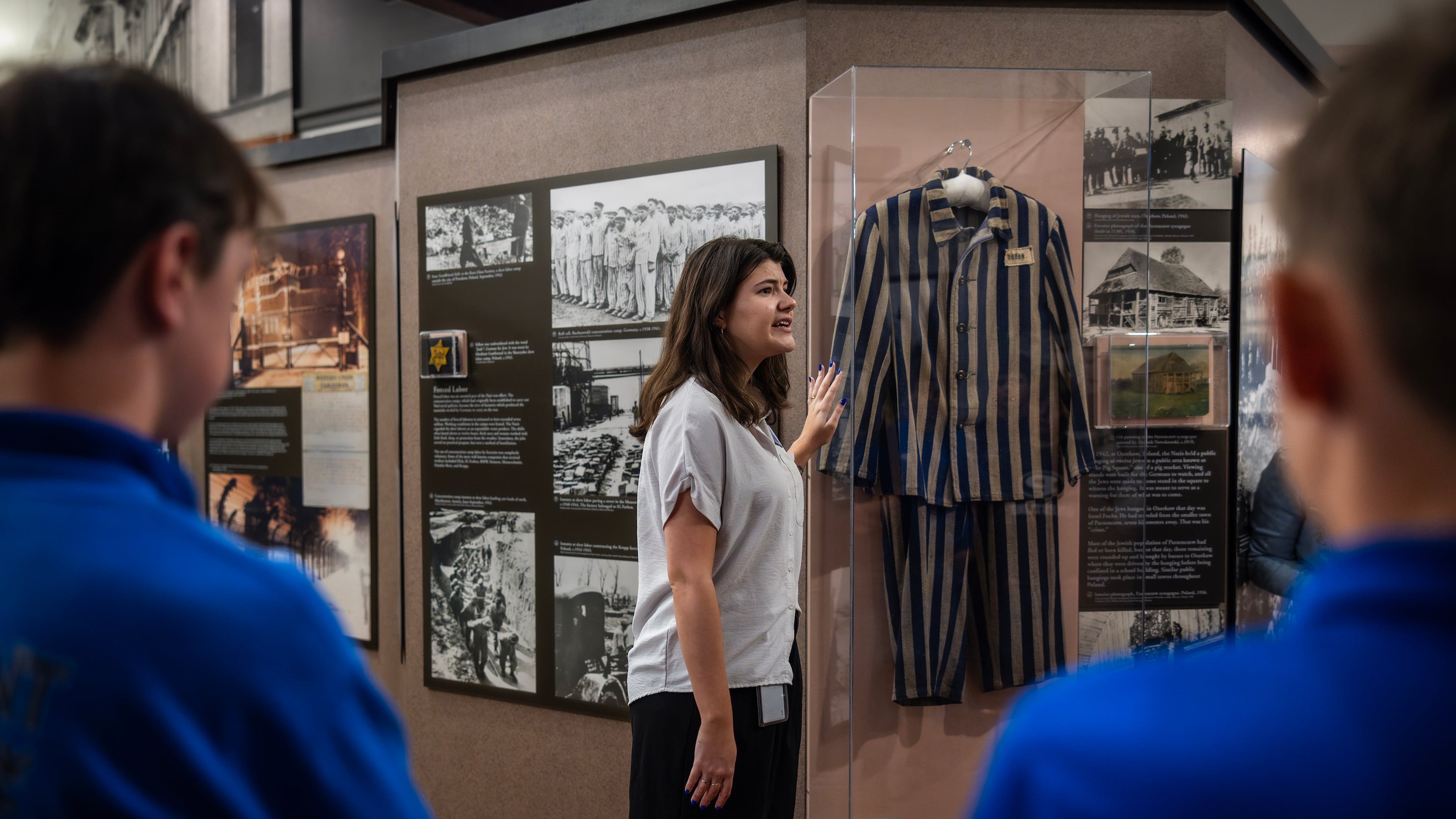 The docent Ariana Gil speaks to a school group from Monticello, Ga., at the Breman, a Holocaust museum in Atlanta, April 17, 2024. (Audra Melton/The New York Times)
