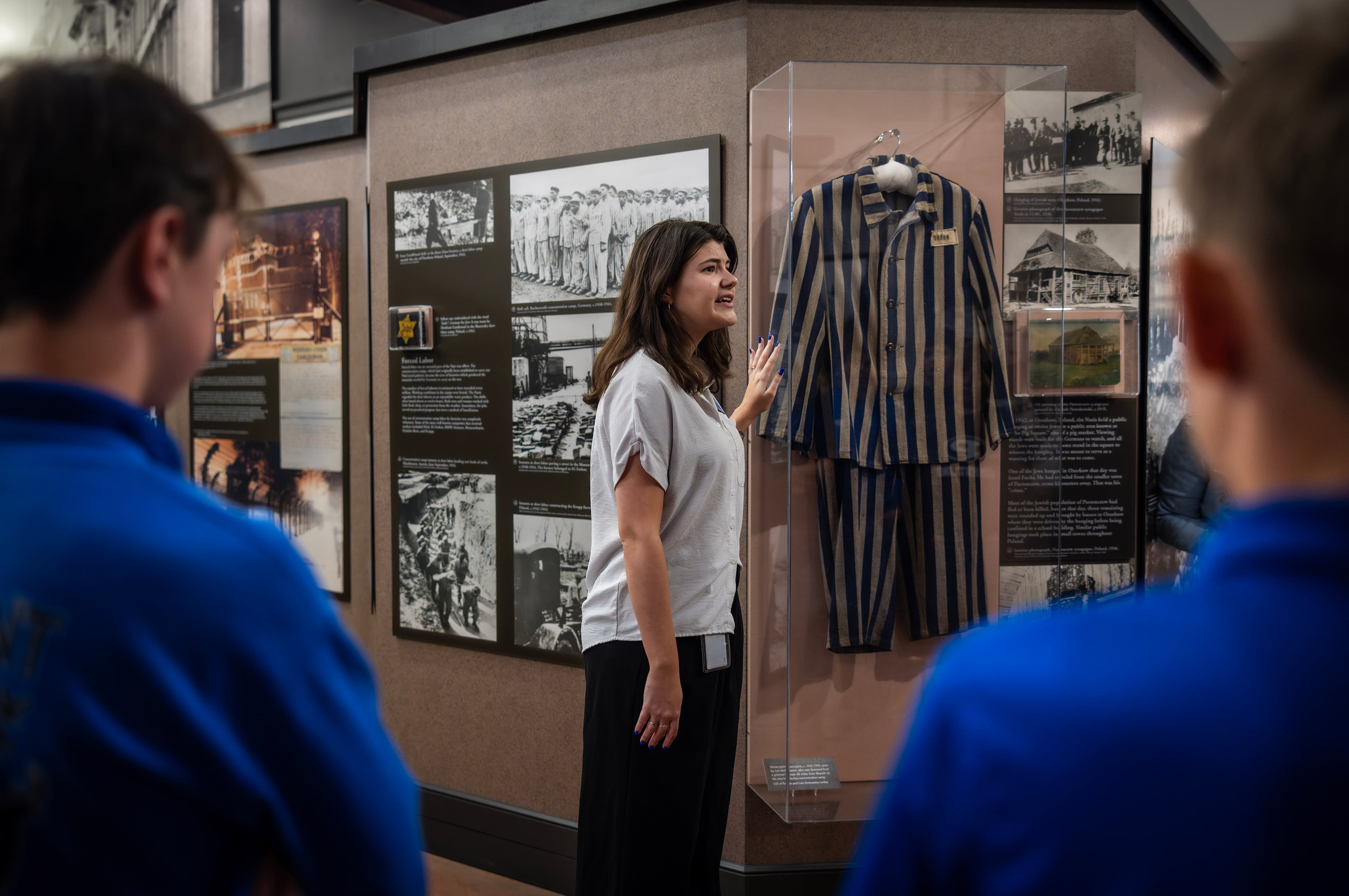 The docent Ariana Gil speaks to a school group from Monticello, Ga., at the Breman, a Holocaust museum in Atlanta, April 17, 2024. (Audra Melton/The New York Times)