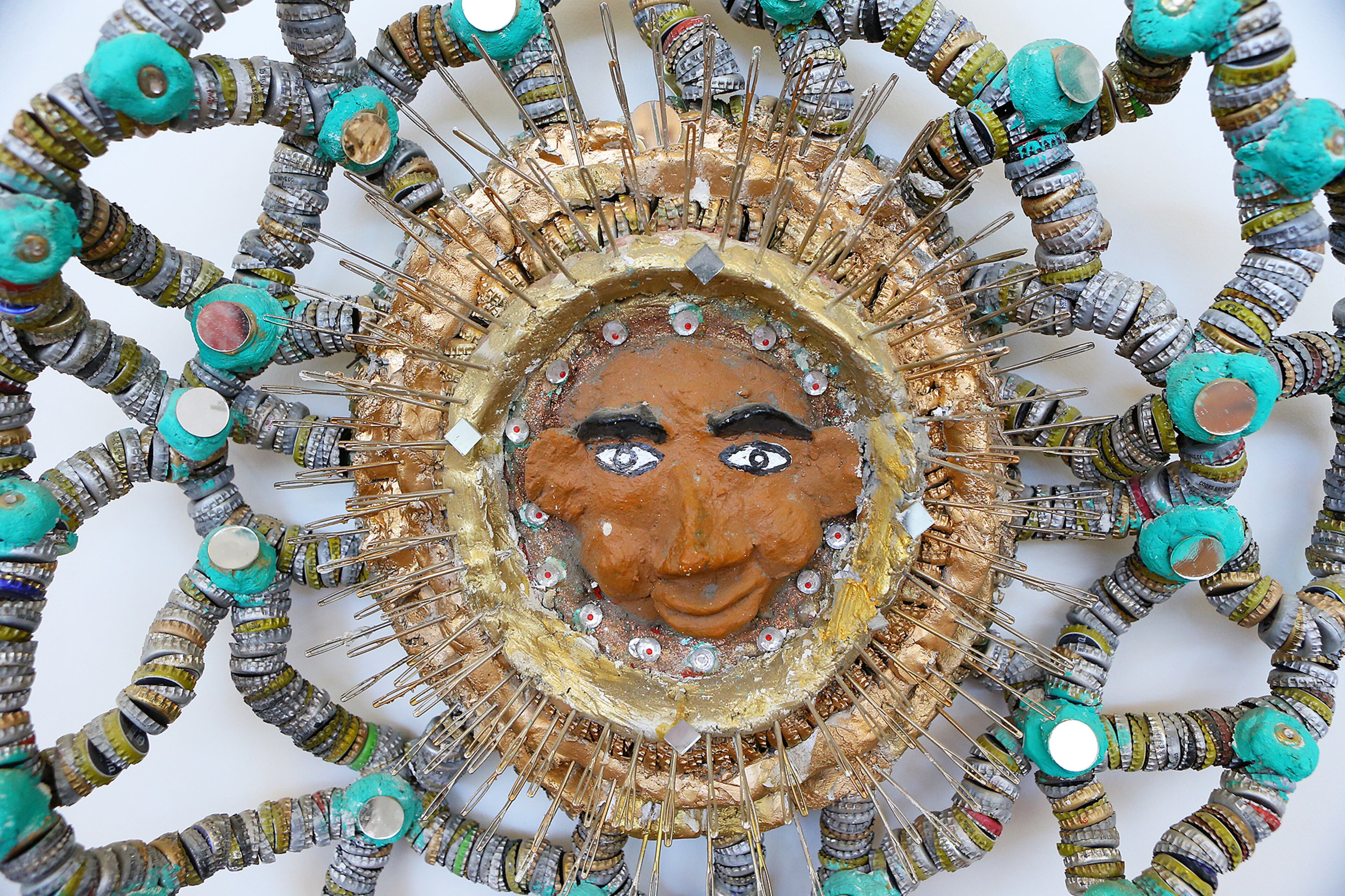 An untitled work that includes sewing needles and bottle caps by Mr. Imagination on display at the Tubman Museum of African American Art, History and Culture on Wednesday, May 6, 2015, in Macon. Curtis Compton / ccompton@ajc.com
