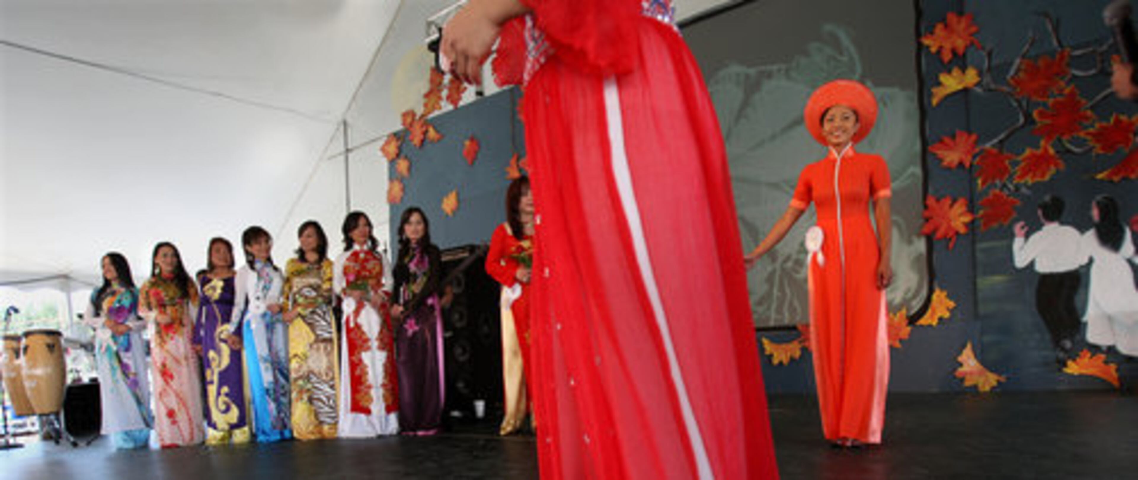 Contestants take turn to showcase thier silk tunic ao dai, a Vietnamese national costume, during the first round of the traditional dress contest.