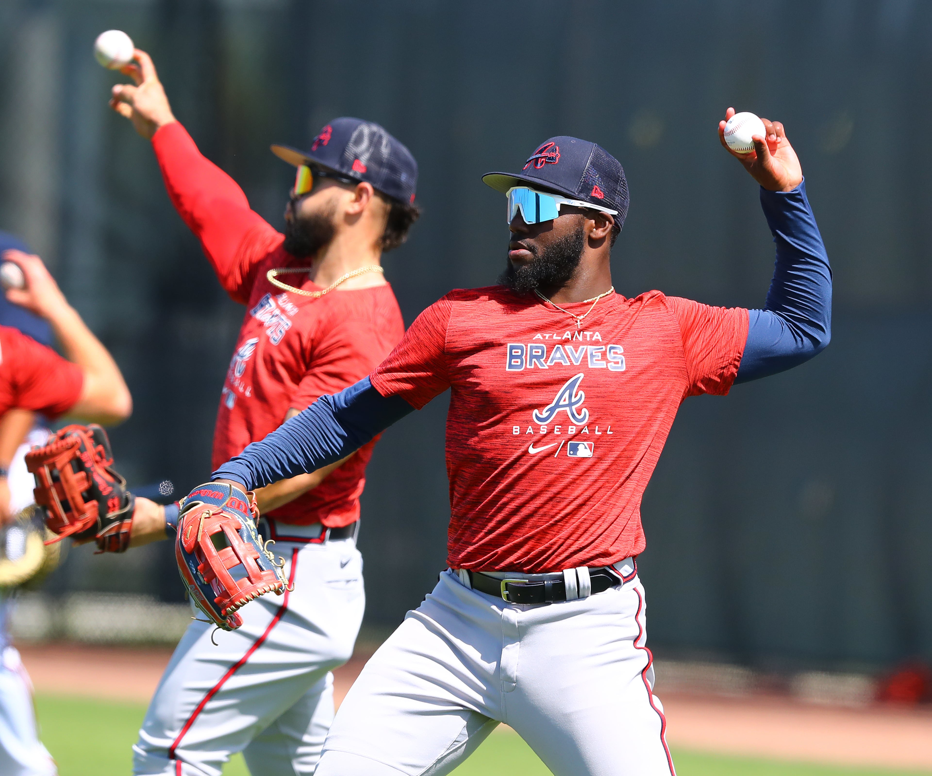 030622 North Port: Atlanta Braves outfielder Michael Harris II loosens up his arm with teammates on the first day of Braves minor league spring training camp on Sunday, March 6, 2022, in North Port. “Curtis Compton / Curtis.Compton@ajc.com”`