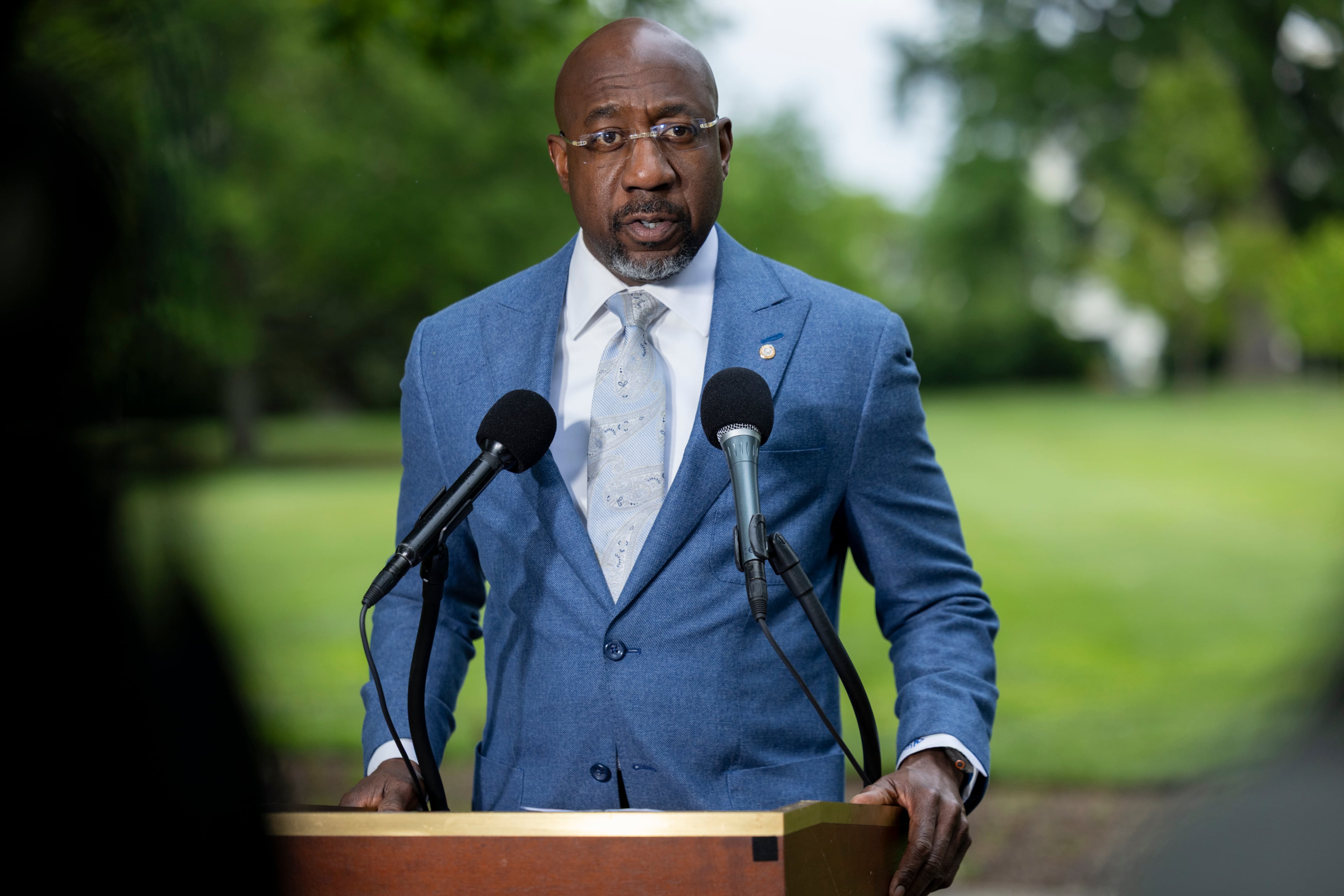 U.S. Sen. Raphael Warnock, D-Ga., speaks at a news conference on the Voting Rights Act, across the street from the Supreme Court, in Washington, D.C., in April. (Nathan Posner for the AJC)