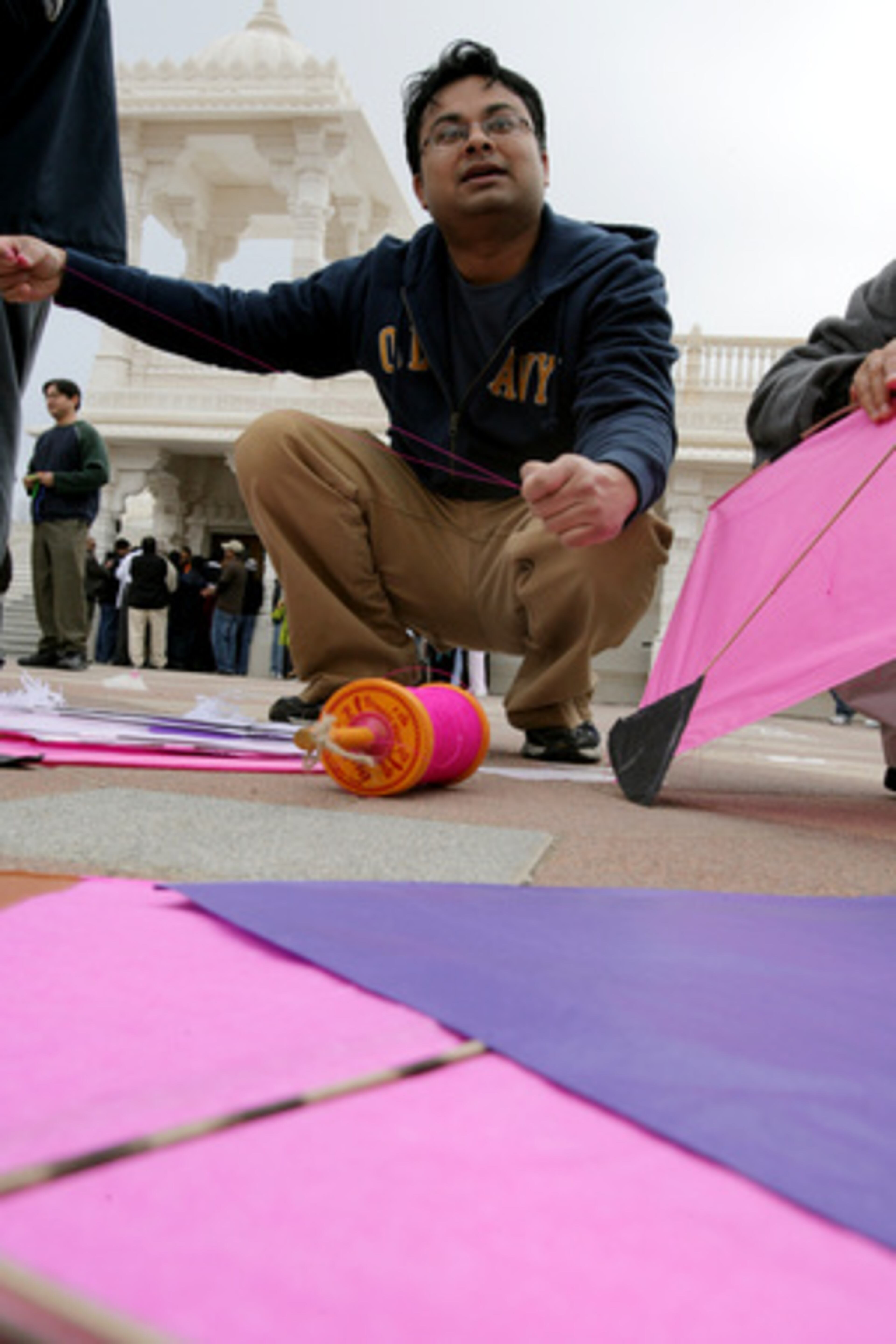 Mahesh Patel of Jonesboro getssome kites ready to fly.
