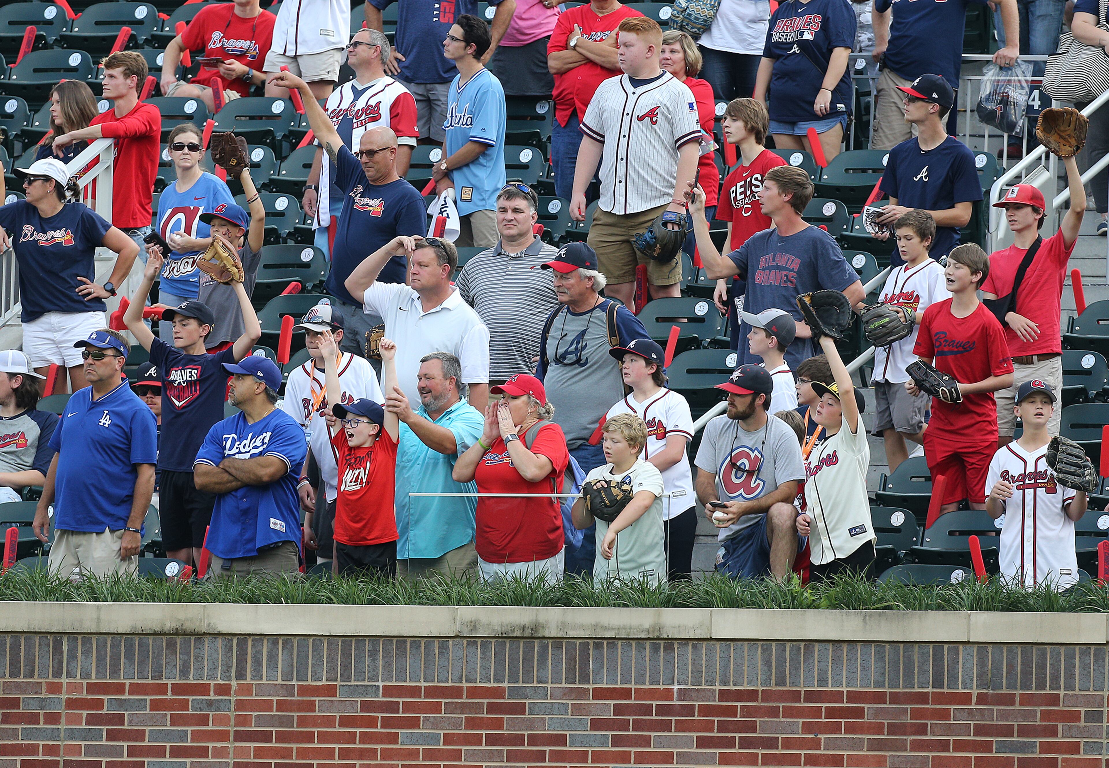 October 7, 2018 Atlanta: Atlanta Braves fans fill center field to catch balls hit out of the park during batting practice before taking on the Los Angeles Dodgers in Game 3 of a National League Division Series baseball game on Sunday, Oct 7, 2018, in Atlanta. Curtis Compton/ccompton@ajc.com