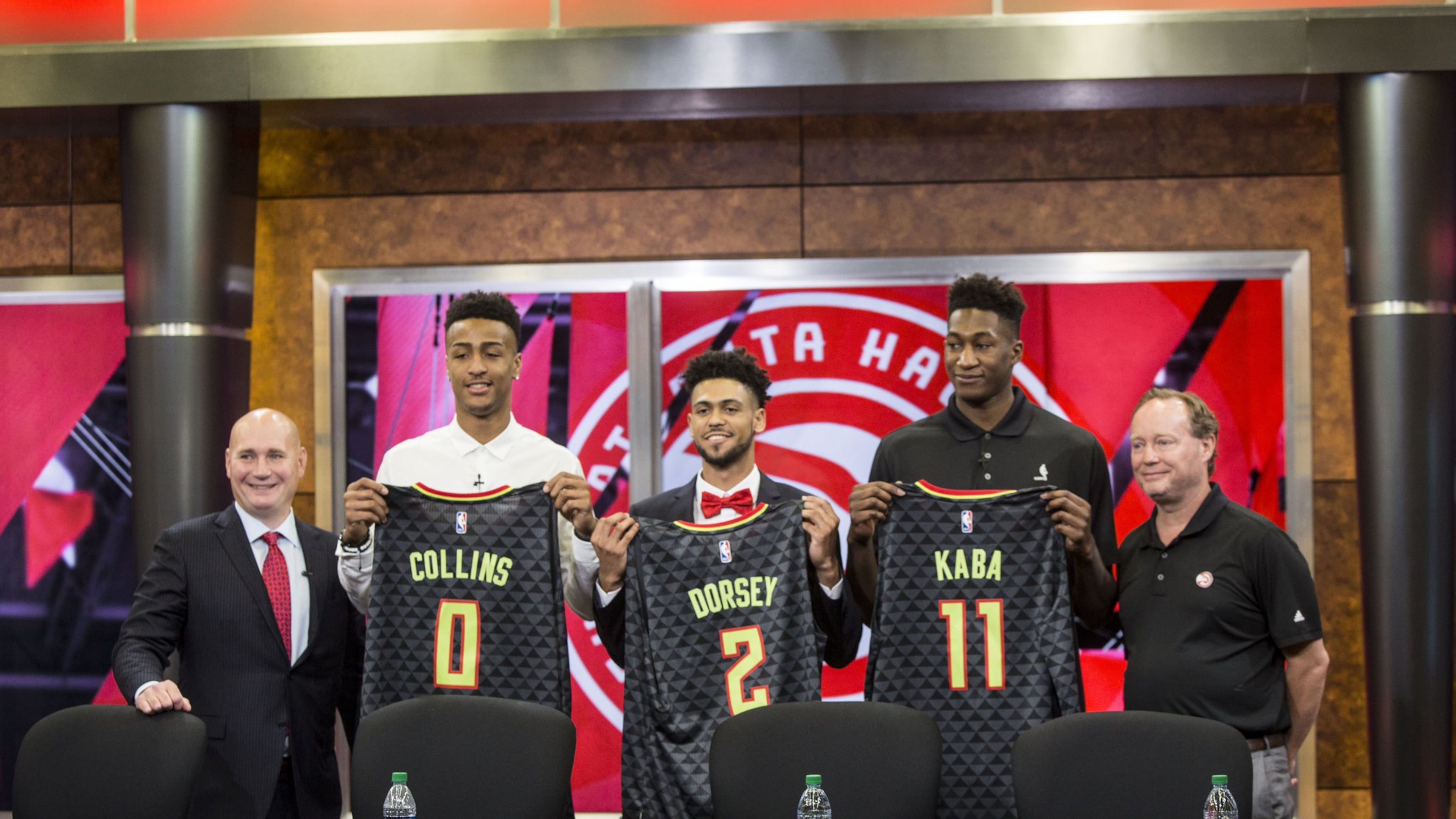 Atlanta Hawks General Manager, Travis Schlenk (far left), and Head Coach Mike Budenholzer (far right), stand on the outside of rookies: John Collins (left), Tyler Dorsey (middle) and Alpha Kaba (right). Chad Rhym/ Chad.Rhym@ajc.com