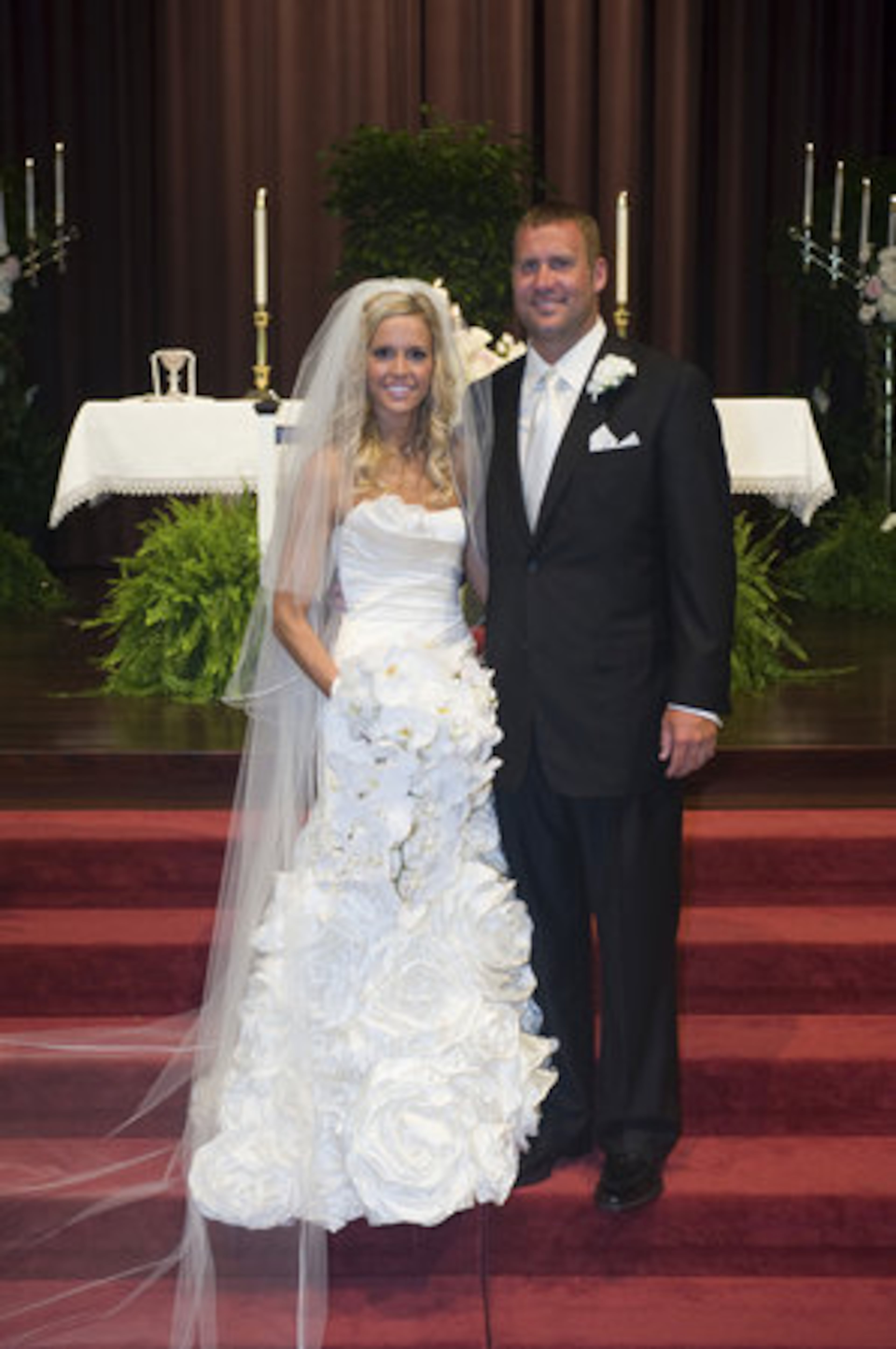 Pittsburgh Steelers quarterback Ben Roethlisberger, right, and Ashley Harlan of New Castle, Pa. pose for a photo after they were married at the Christ Church at Grove Farm in Sewickley, Pa. on Saturday, July 23, 2011.