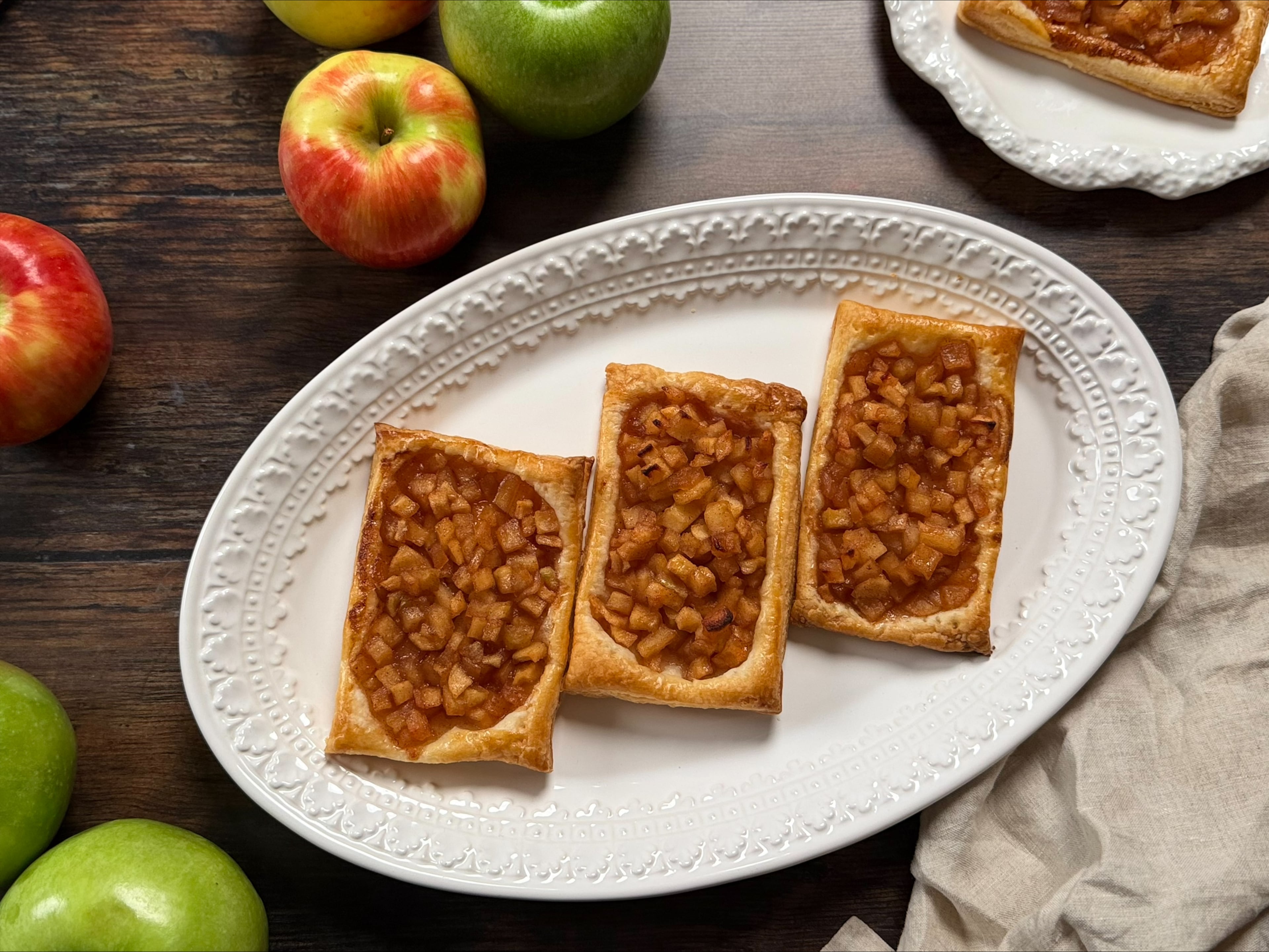 These apple pie pastries are the perfect fall treats. They’re crispy, flaky and scented with cinnamon. (Monti Carlo/AJC)