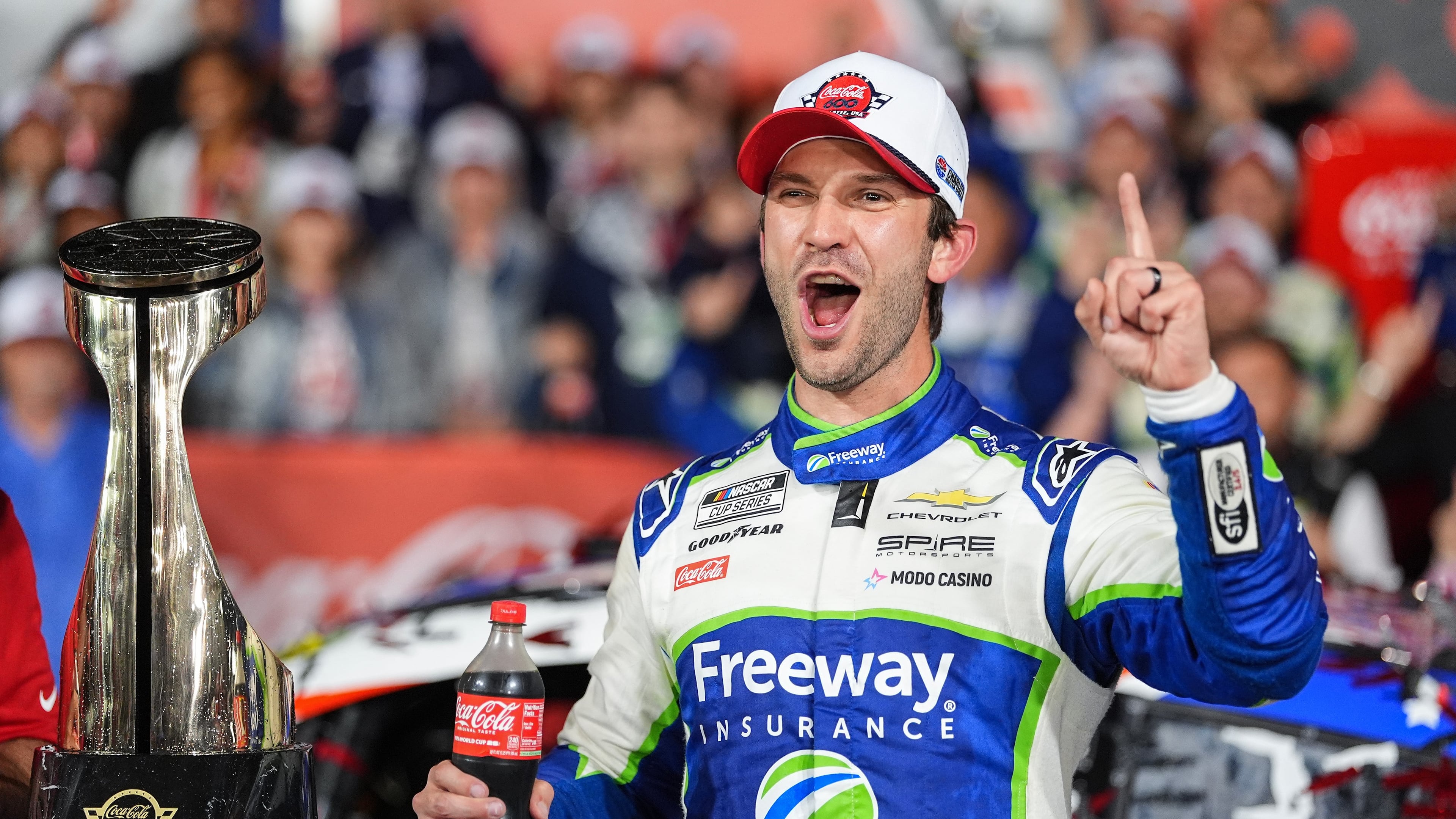 Daniel Suarez celebrates in Victory Lane after winning a NASCAR Cup Series auto race, Sunday, May 24, 2026, in Charlotte, N.C. (AP Photo/Matt Kelley)