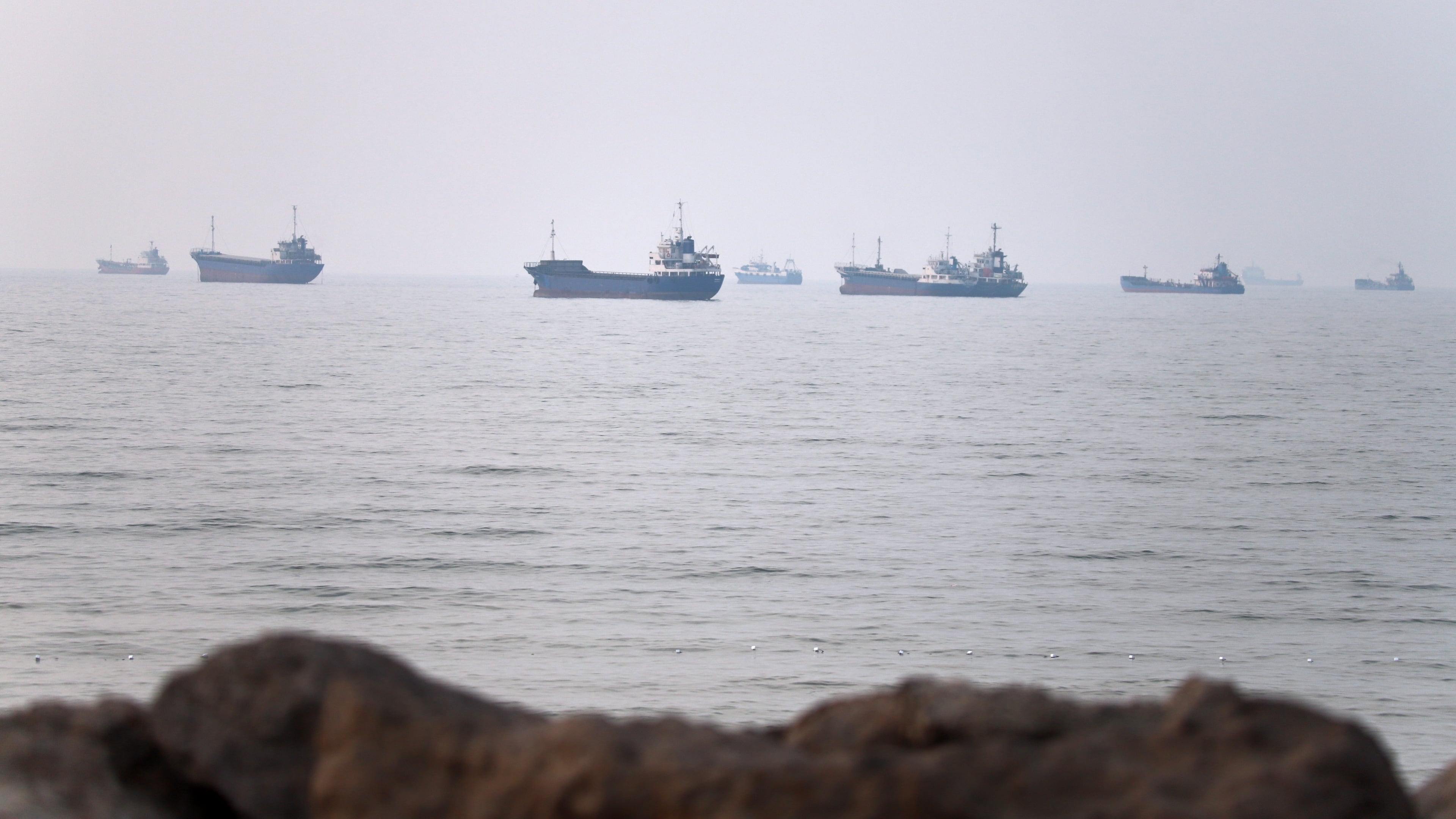 Commercial vessels are seen in the Strait of Hormuz off Bandar Abbas, Iran, Tuesday, June 30, 2026. (Amirhosein Khorgooi/ISNA via AP)
