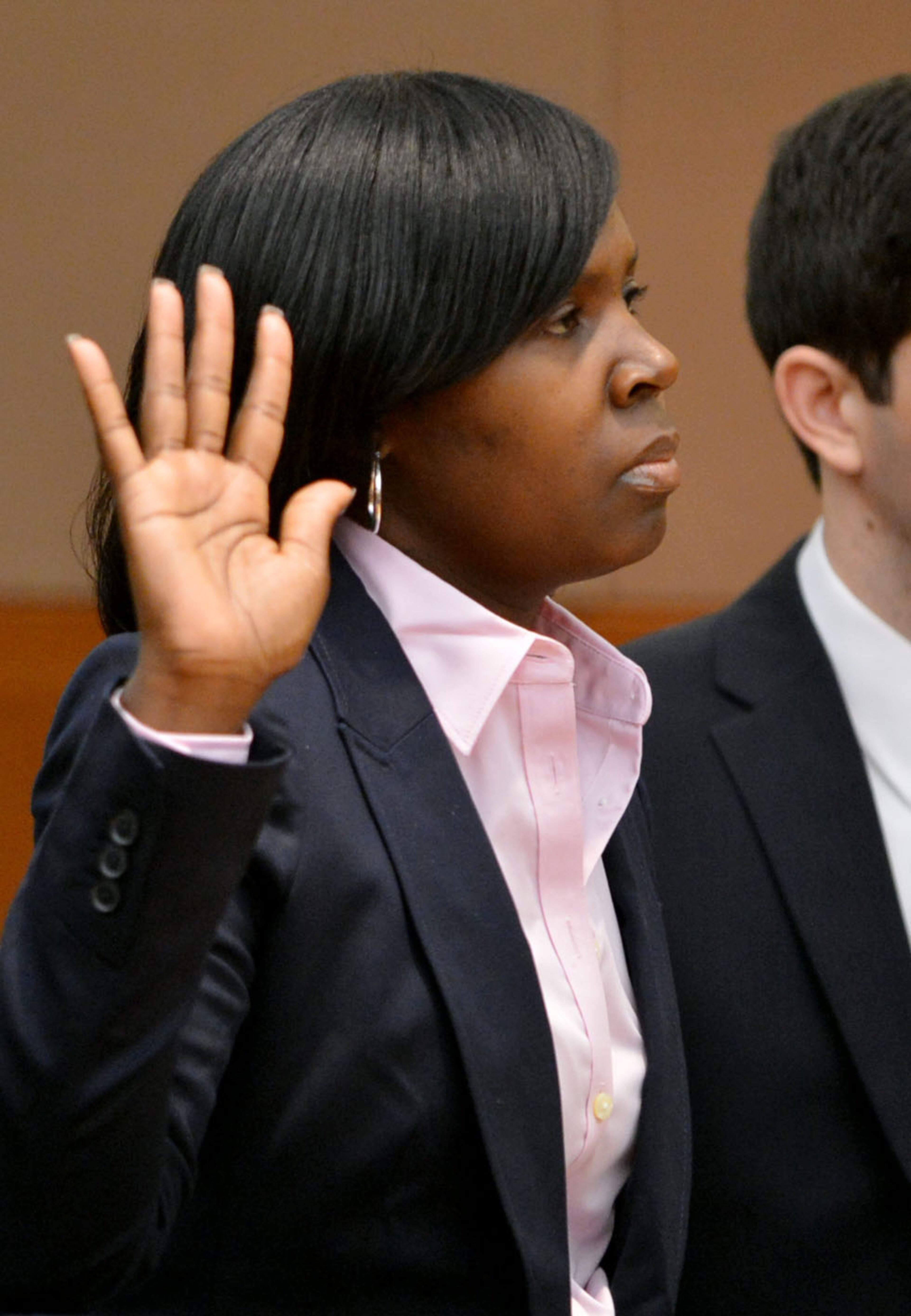 Sandra Ward, sits with her attorney Page Pate during the hearing. Ward, a former administrator at Parks Middle School, pleaded guilty to a reduced charge. She was sentenced to serve one year probation, repay $5,000 she received in bonus money, perform 250 hours of community service and cooperate with the prosecution. Educators in the Atlanta Public Schools cheating scandal enter pleas before Judge Jerry Baxter in Fulton County Superior Court Friday, February 21, 2014. Any defendants in the widespread Atlanta Public Schools cheating case who don't make guilty pleas by the end of Friday will likely go on trial this spring, including Superintendent Beverly Hall and senior members of her staff. KENT D. JOHNSON / KDJOHNSON@AJC.COM