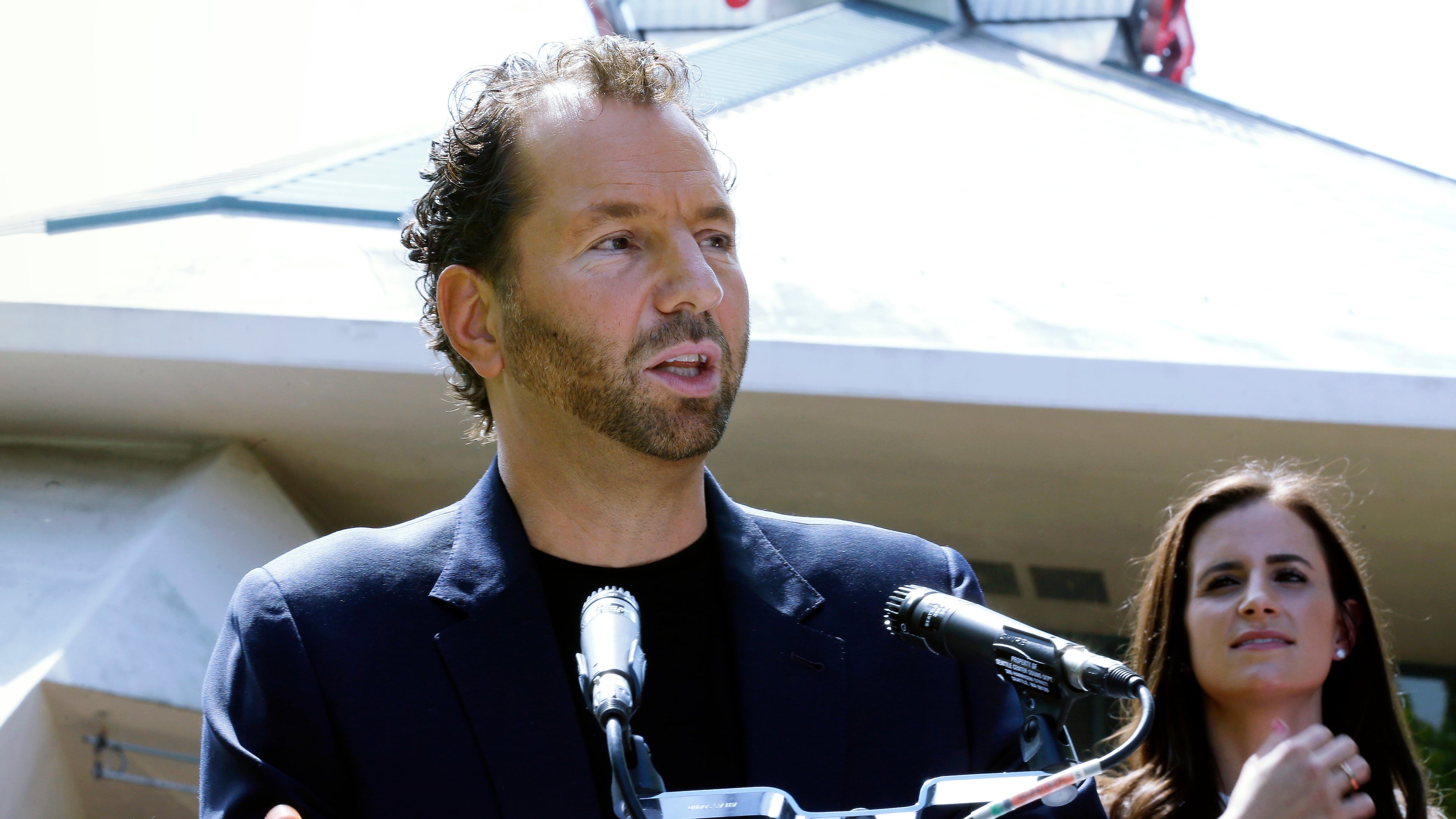 FILE- Michael Rapino, President and CEO of Live Nation Entertainment, speaks during a news conference in Seattle on June 7, 2017. (AP Photo/Ted S. Warren, File)