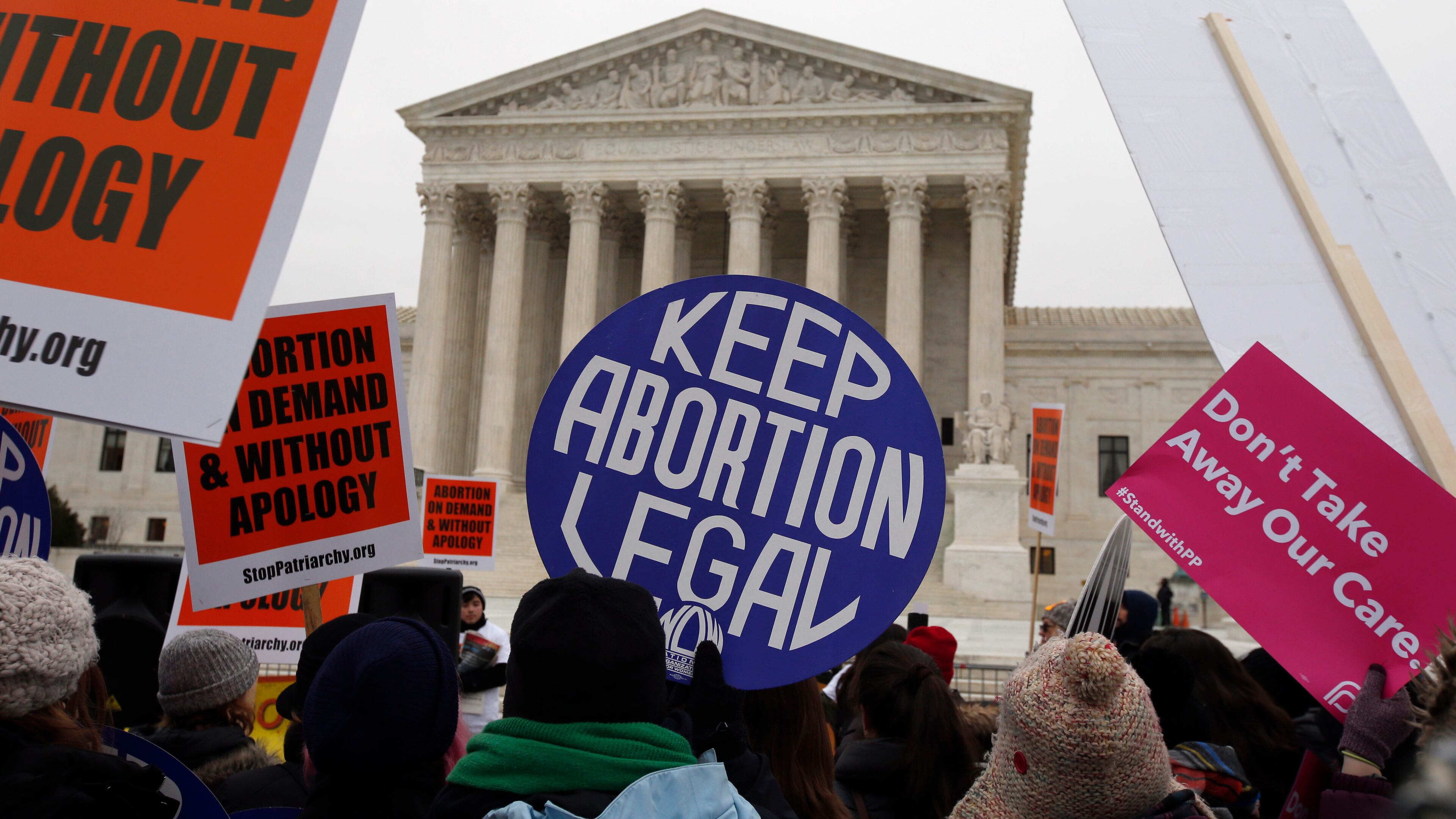 Abortion rights and anti-abortion rights activists protest in front of the U.S. Supreme Court in Washington, D.C. The mother of an Atlanta-area woman says her pregnant daughter was declared brain-dead more than three months ago, but Georgia’s abortion law has caused doctors to keep the woman on life support. (Associated Press file photo)