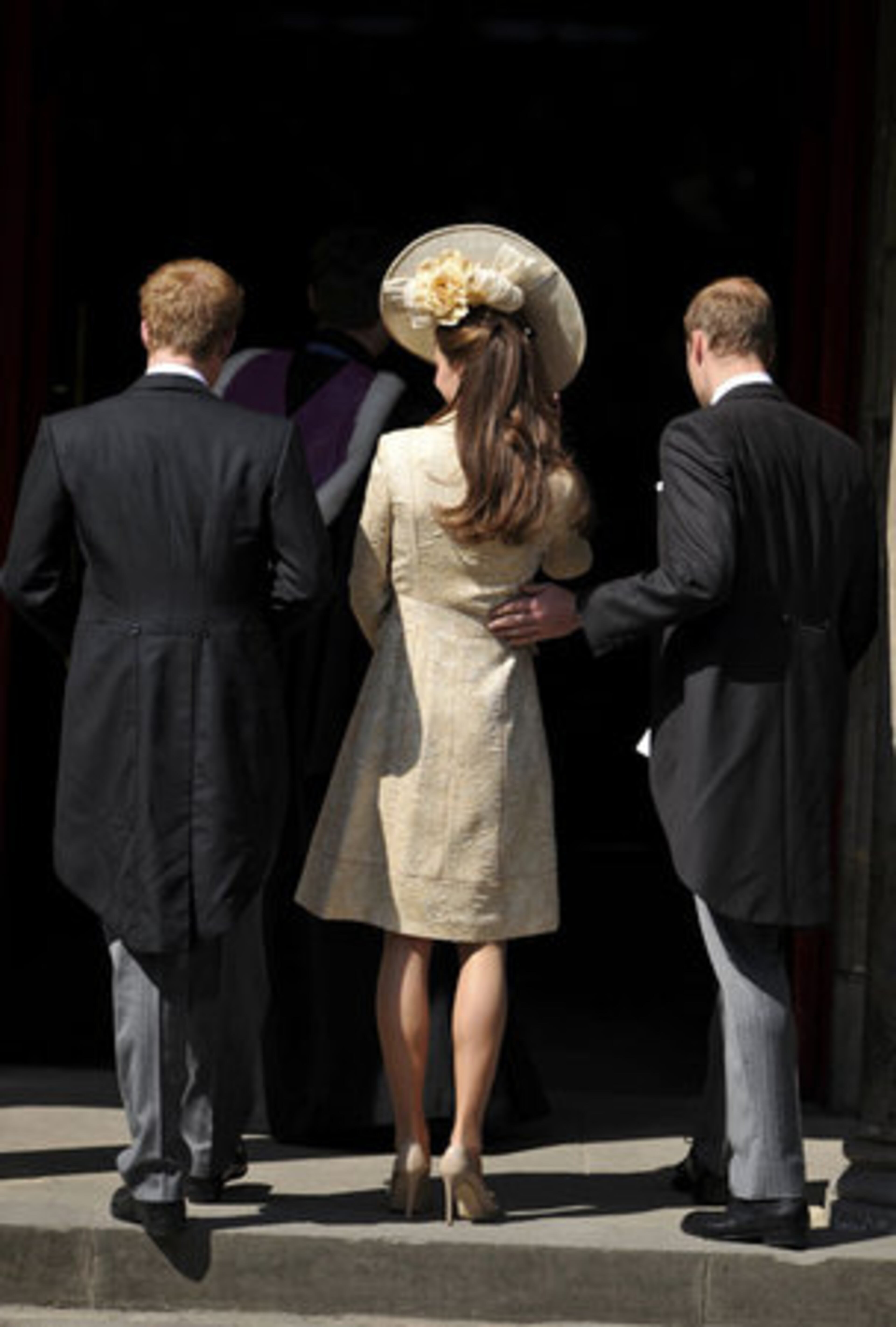 Britain's Prince Harry, Catherine, Duchess of Cambridge, and Prince William, from left, arrive for the royal wedding.