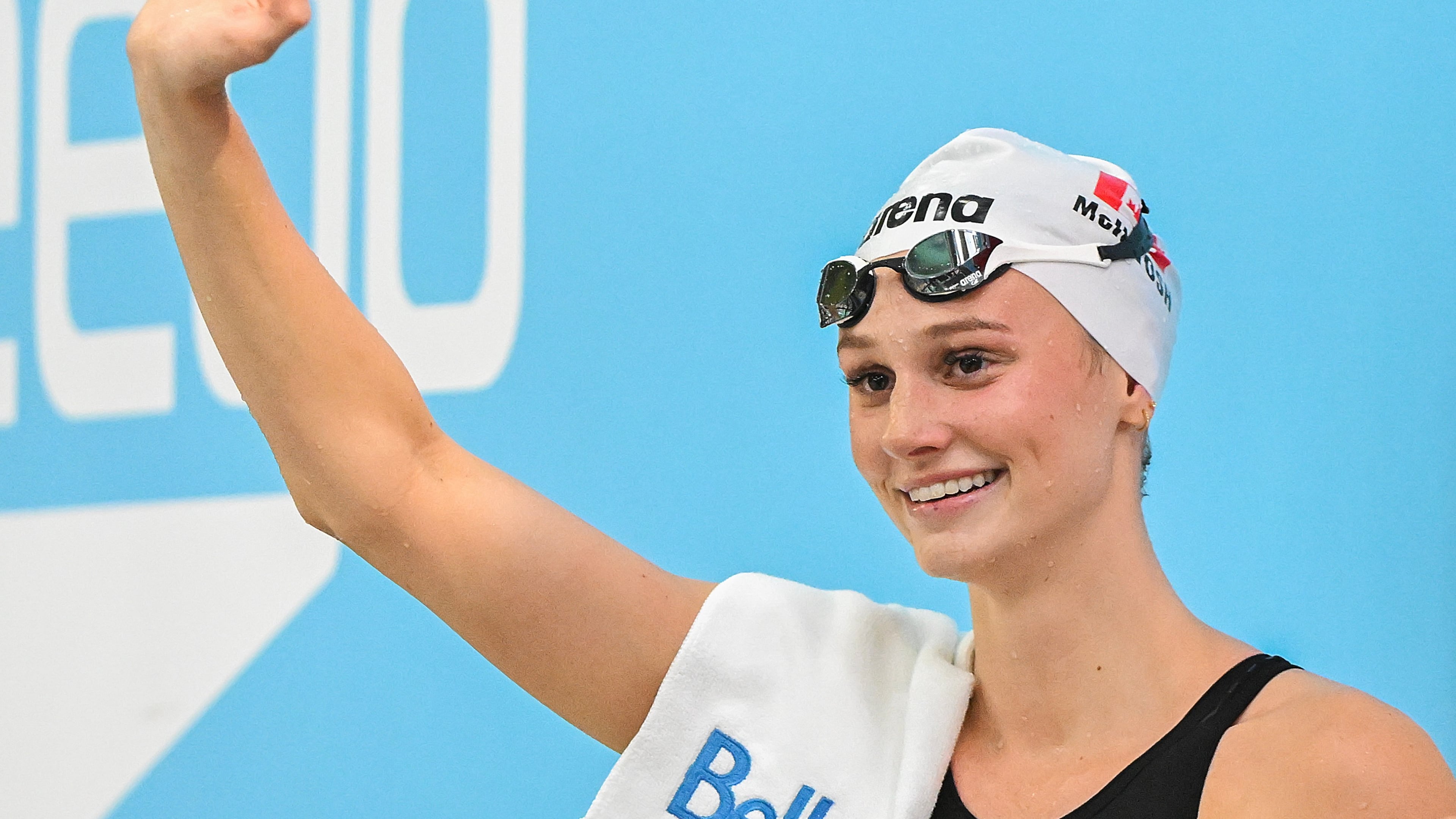 Summer McIntosh waves to fans after setting a new world in the women's 200m butterfly final at the Canadian Swimming Trials in Montreal, on Sunday, July 5, 2026. (Graham Hughes/The Canadian Press via AP)