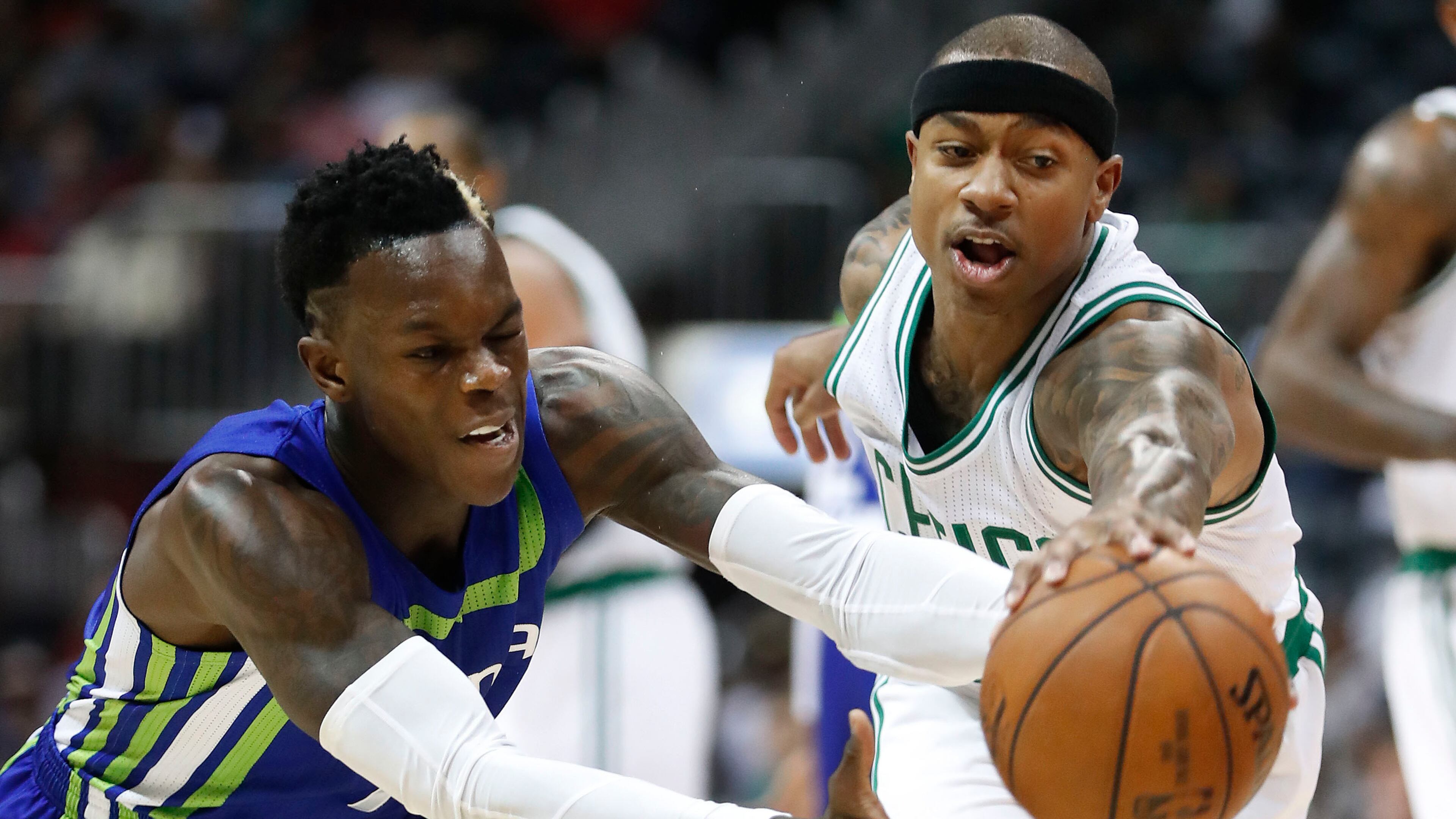 Atlanta Hawks guard Dennis Schroder, left, and Boston Celtics guard Isaiah Thomas chase down a loose ball during the first half of an NBA college basketball game Friday, Jan. 13, 2017, in Atlanta. (AP Photo/John Bazemore)