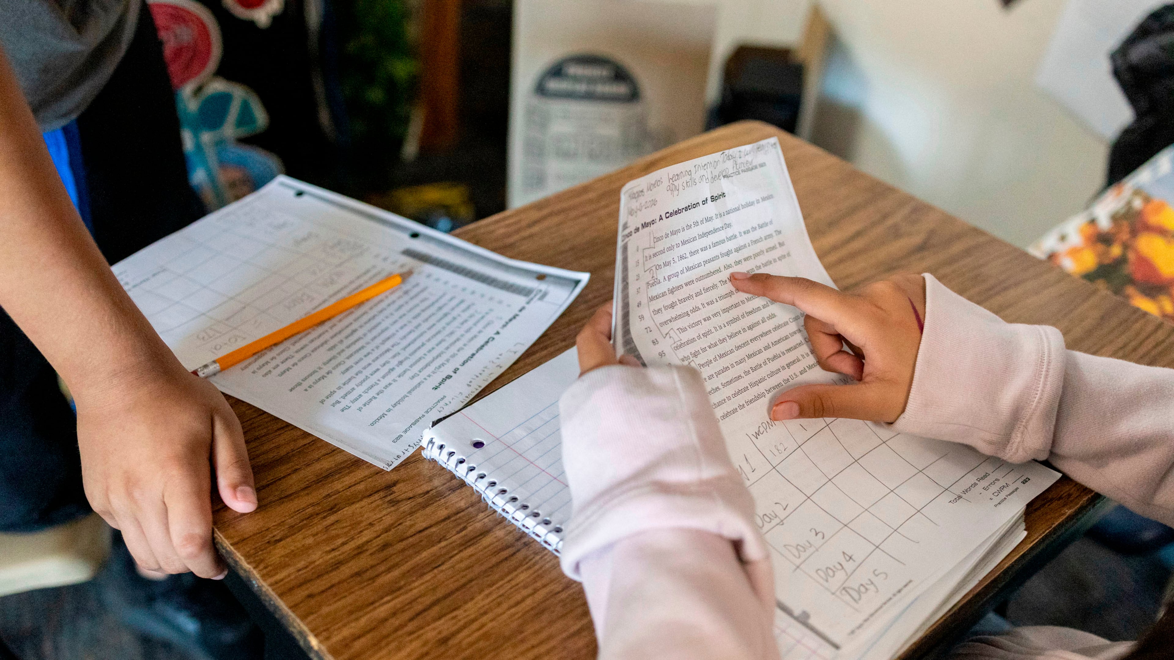 FILE - Sixth graders read a passage and give constructive feedback to their partners during Nancy Barajas' class at Fairview Elementary School on Wednesday, May 6, 2026, in Modesto, Calif. (AP Photo/Annie Barker,File)