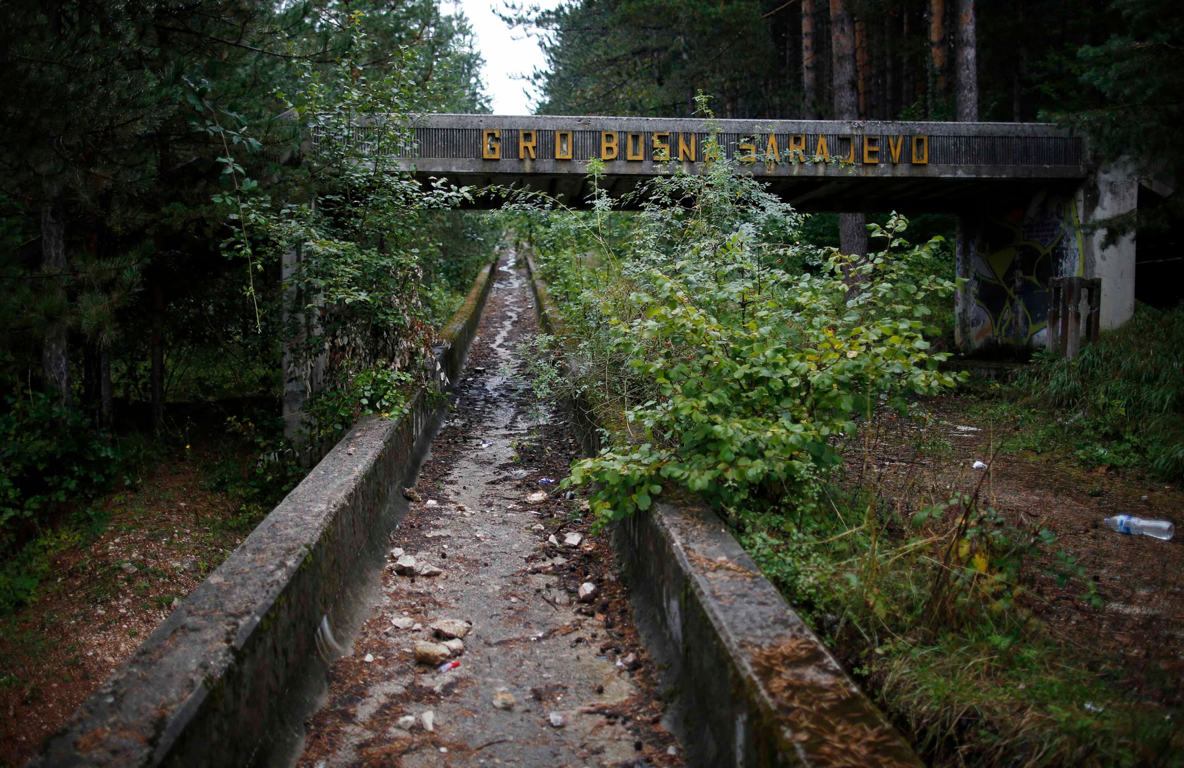 The disused bobsleigh track from the Sarajevo 1984 Winter Olympics is seen on Mount Trebevic, near Saravejo September 19, 2013. Abandoned and left to crumble into oblivion, most of the 1984 Winter Olympic venues in Bosnia's capital Sarajavo have been reduced to rubble by neglect as much as the 1990s conflict that tore apart the former Yugoslavia. The bobsleigh and luge track at Mount Trebevic, the Mount Igman ski jumping course and accompanying objects are now decomposing into obscurity. The bobsleigh and luge track, which was also used for World Cup competitions after the Olympics, became a Bosnian-Serb artillery stronghold during the war and is nowadays a target of frequent vandalism. The clock is now ticking towards the 2014 Winter Olympics, with October 29 marking 100 days to the opening of the Games in the Russian city of Sochi. Picture taken on September 19, 2013. REUTERS/Dado Ruvic