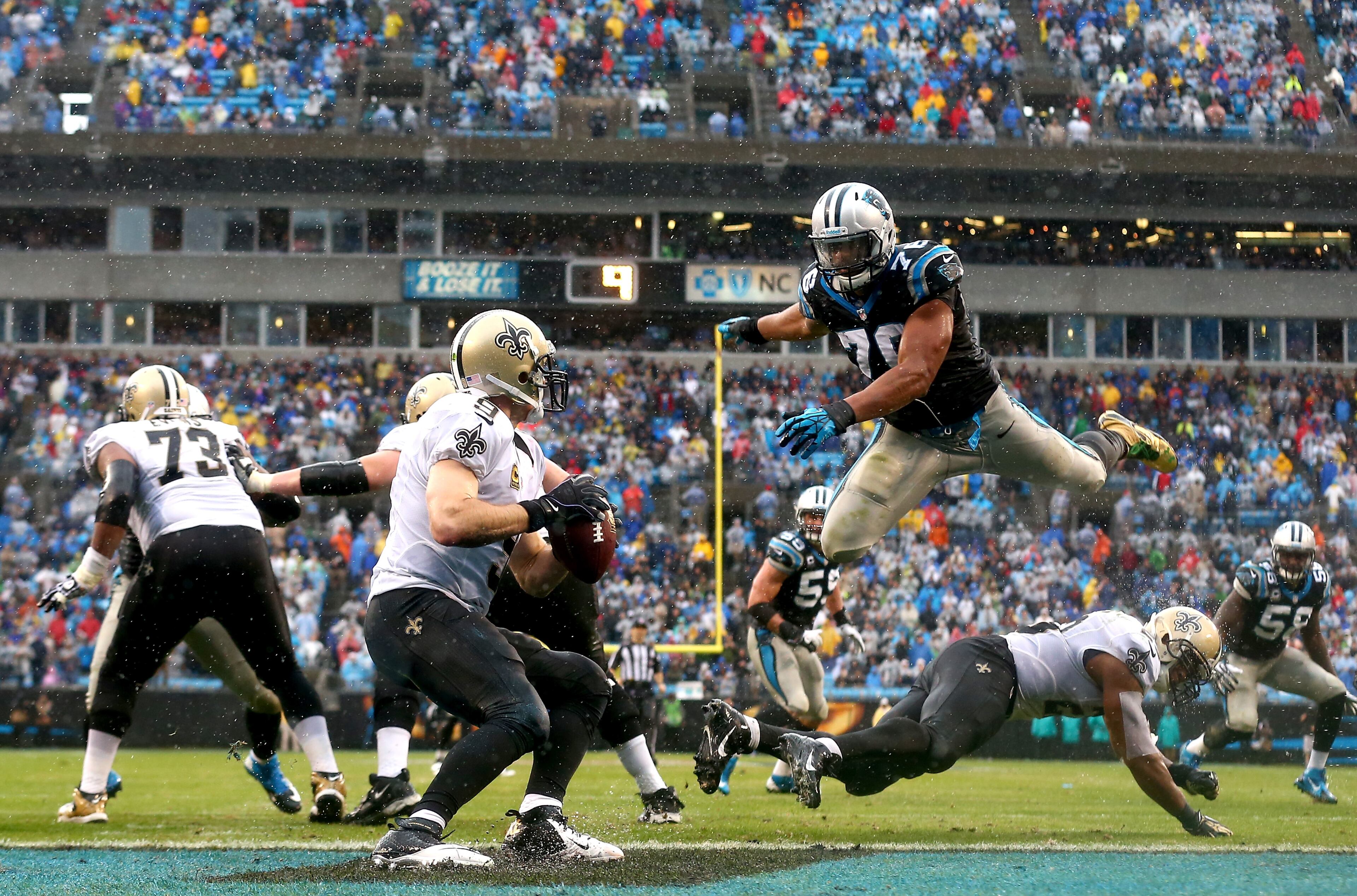 No. 53: Greg Hardy, DE, Panthers. Here, Hardy (76) of the Carolina Panthers leaps over lineman in his pursuit of Saints quarterback Drew Brees on Dec. 22, 2013 at Bank of America Stadium in Charlotte, N.C. (Photo by Streeter Lecka/Getty Images)