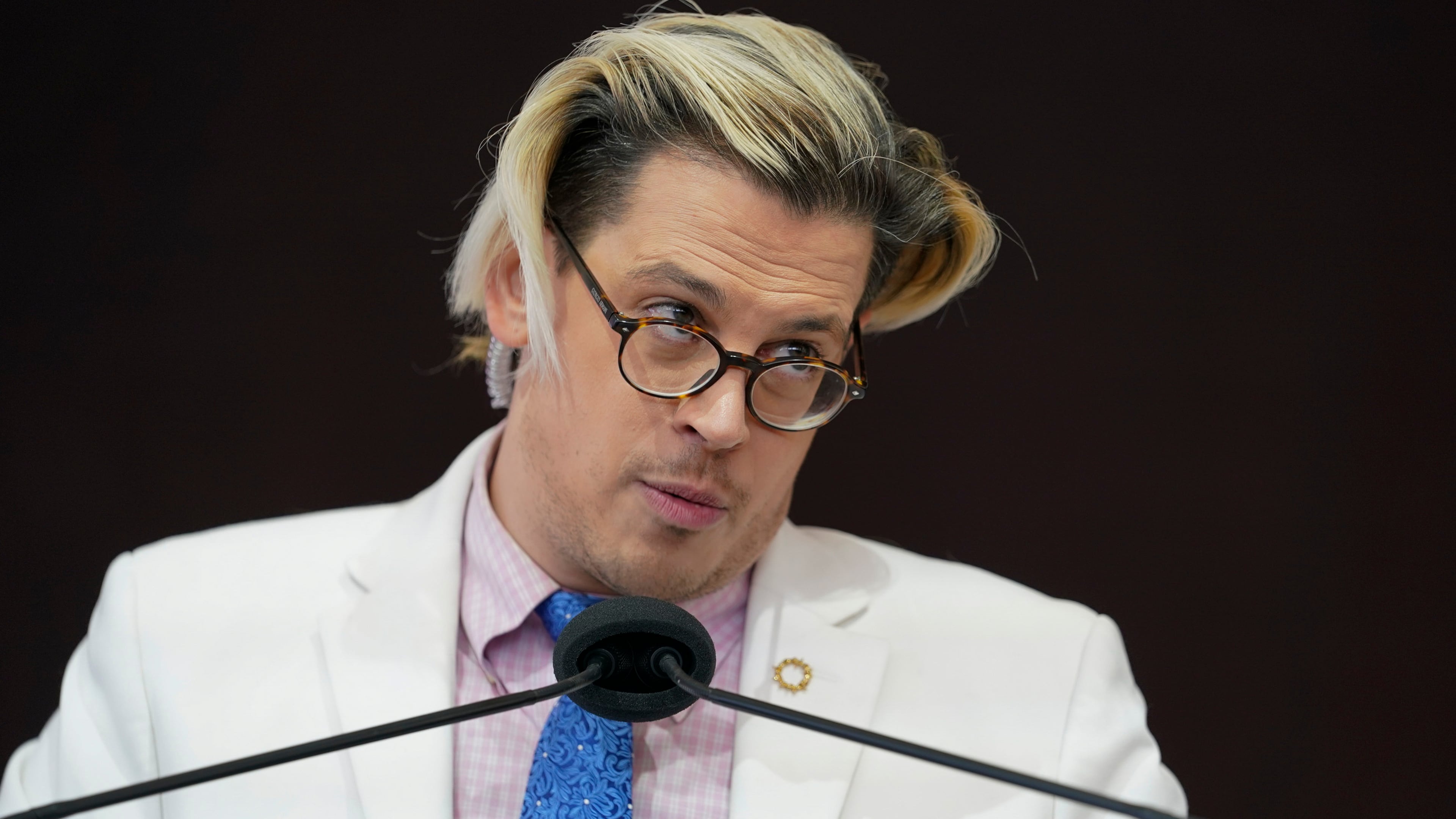 FILE - Activist Milo Yiannopoulos speaks during a rally outside of the Baltimore hotel where the United States Conference of Catholic Bishops are holding its Fall General Assembly meeting in Baltimore, Nov. 16, 2021. (AP Photo/Julio Cortez, File)