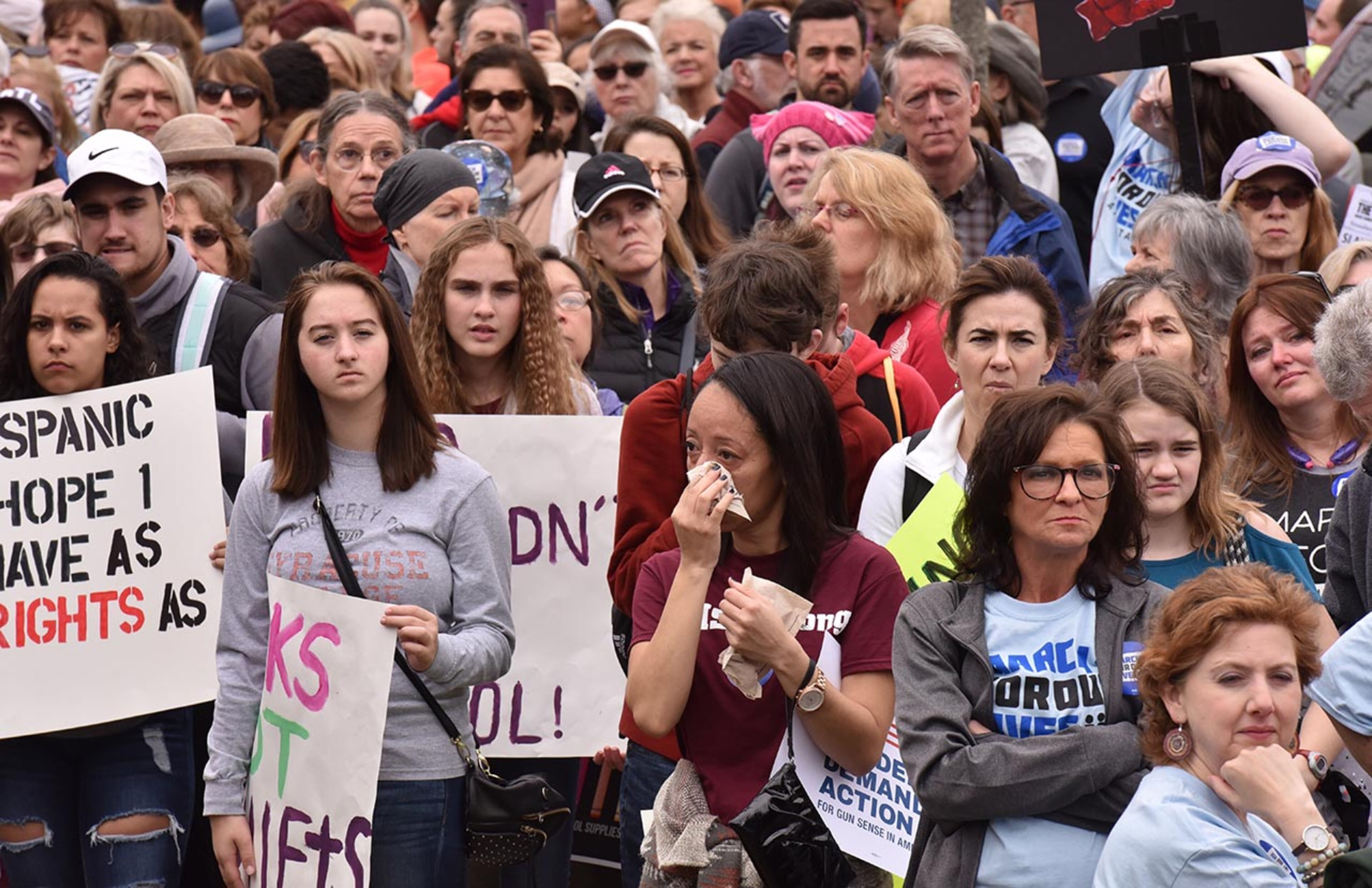 March 24, 2018 Atlanta - Protesters react during moment of silence with survivors at the Center for Civil and Human Rights before walking to Liberty Plaza on Saturday, March 24, 2018. Atlanta police estimated the crowd at near 30,000 for todayâÃôs March for Our Lives. People of all ages were drawn to one of the nationwide demonstrations in a movement begun by student survivors of last monthâÃôs mass killing in a Parkland, Fla., school. Some of those Florida students were among the speakers in Atlanta. HYOSUB SHIN / HSHIN@AJC.COM