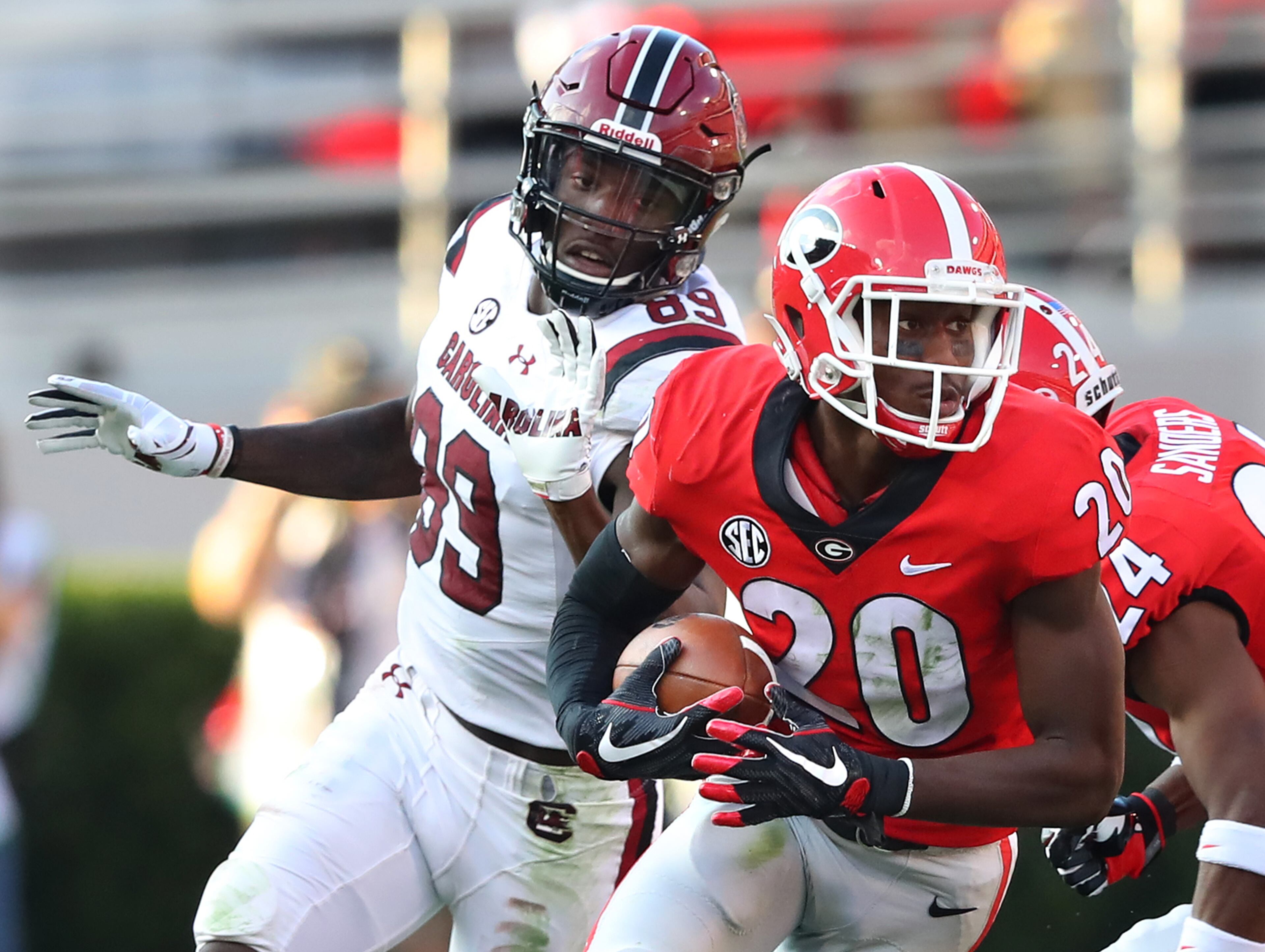 November 4, 2017 Athens: Georgia defensive back J.R. Reed intercepts South Carolina quarterback Jake Bentley in front of wide receiver Bryan Edwards during the second quarter in a NCAA college football game on Saturday, November 4, 2017, in Athens. Curtis Compton/ccompton@ajc.com